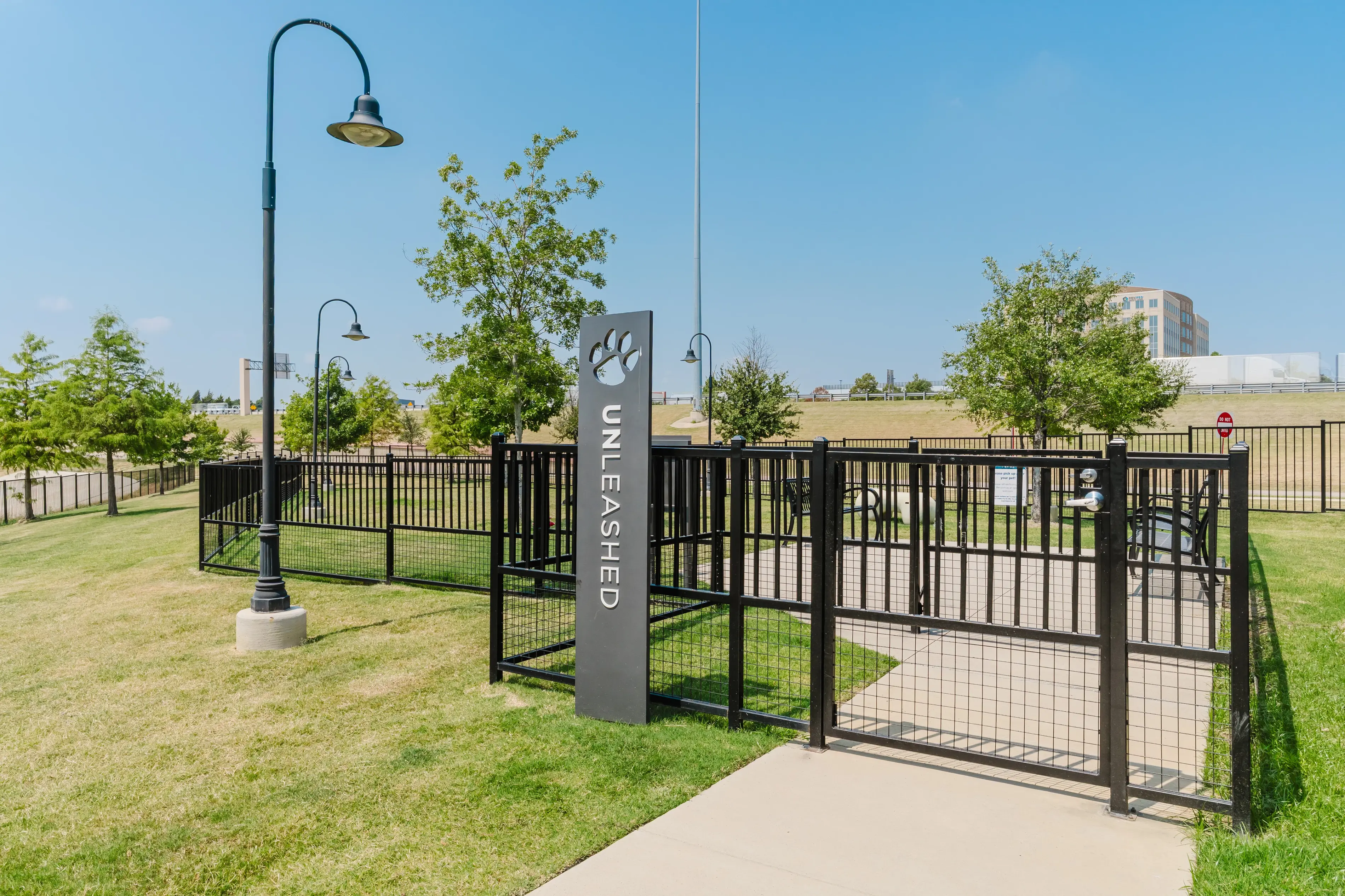 a gated area with a sign and a fence