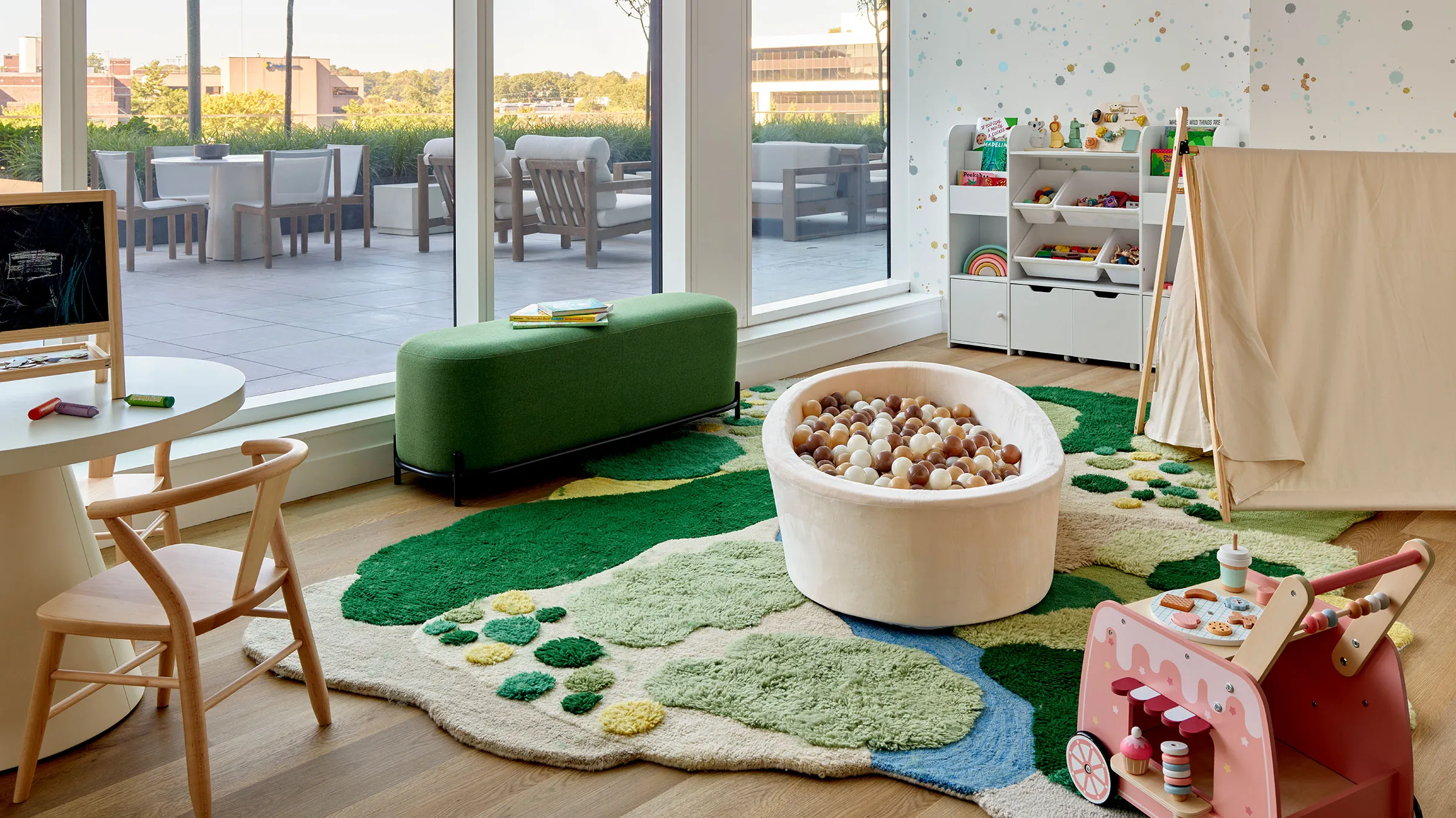 a room with a large window and a large tub of balls