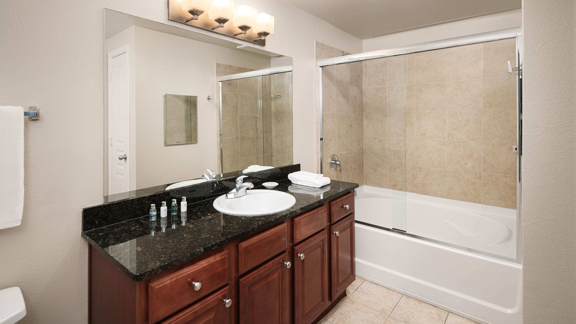a bathroom with a shower and sink