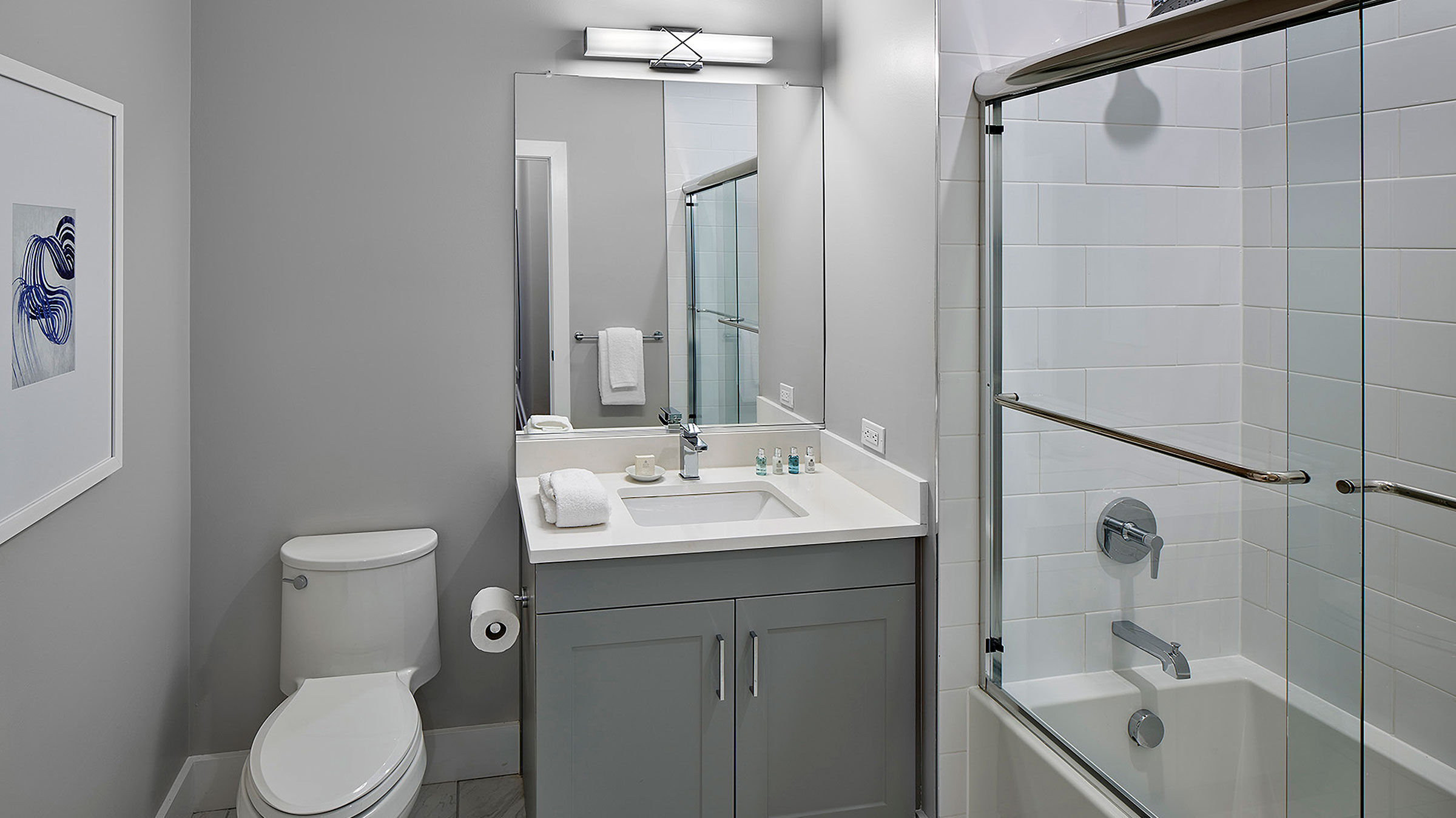 a bathroom with a shower and sink