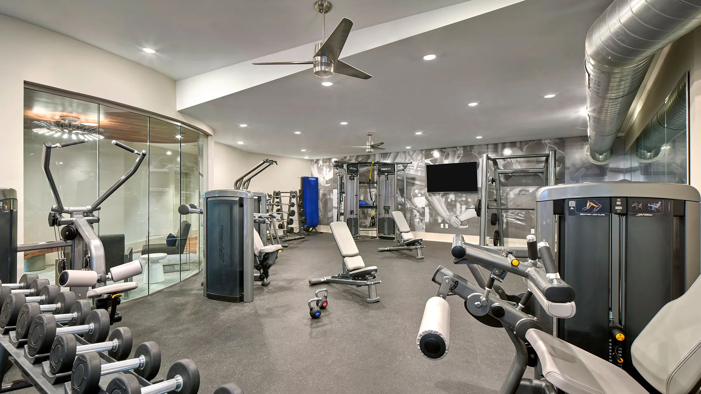 a large gym with exercise equipment