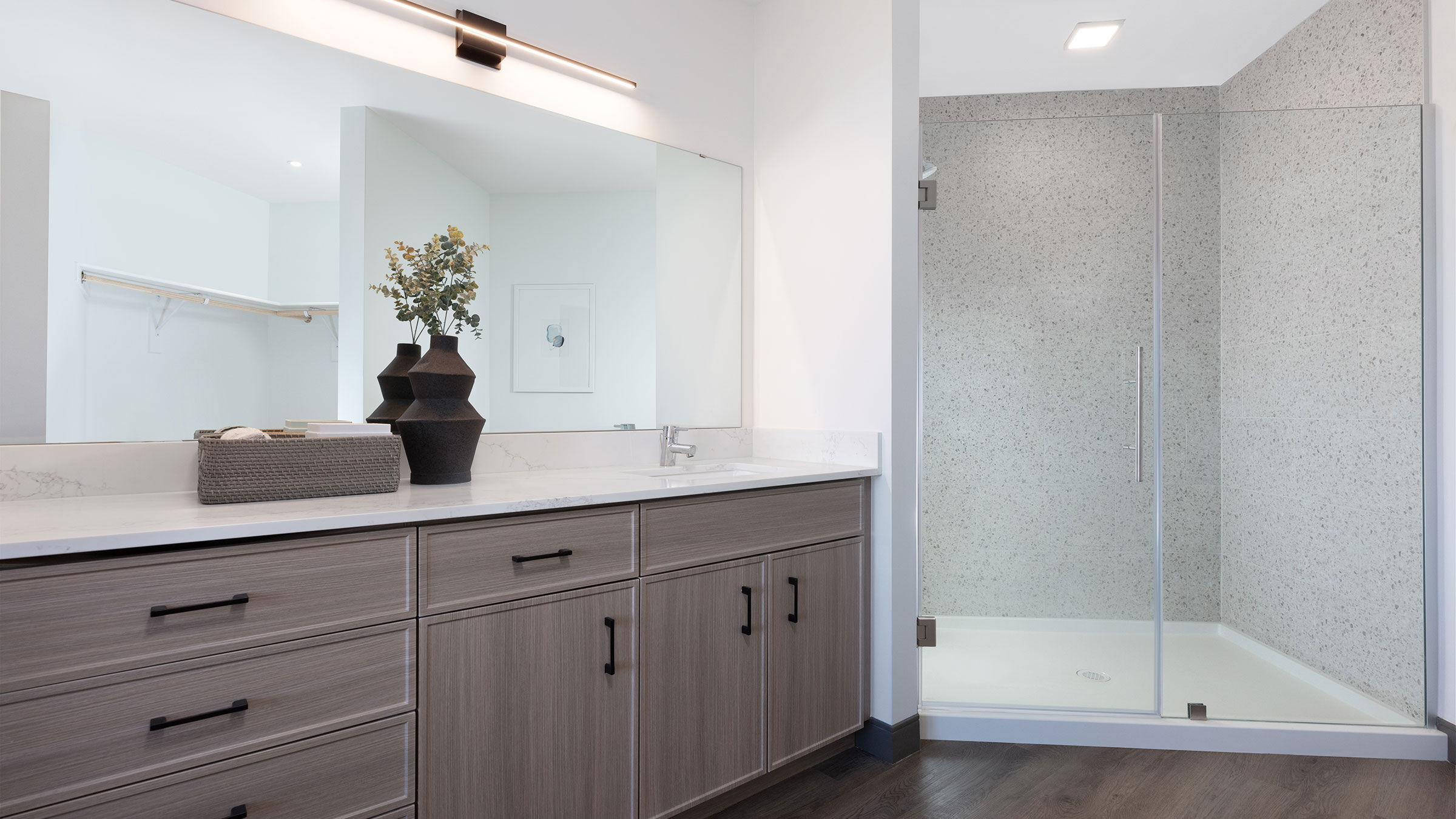 a bathroom with a shower and a sink