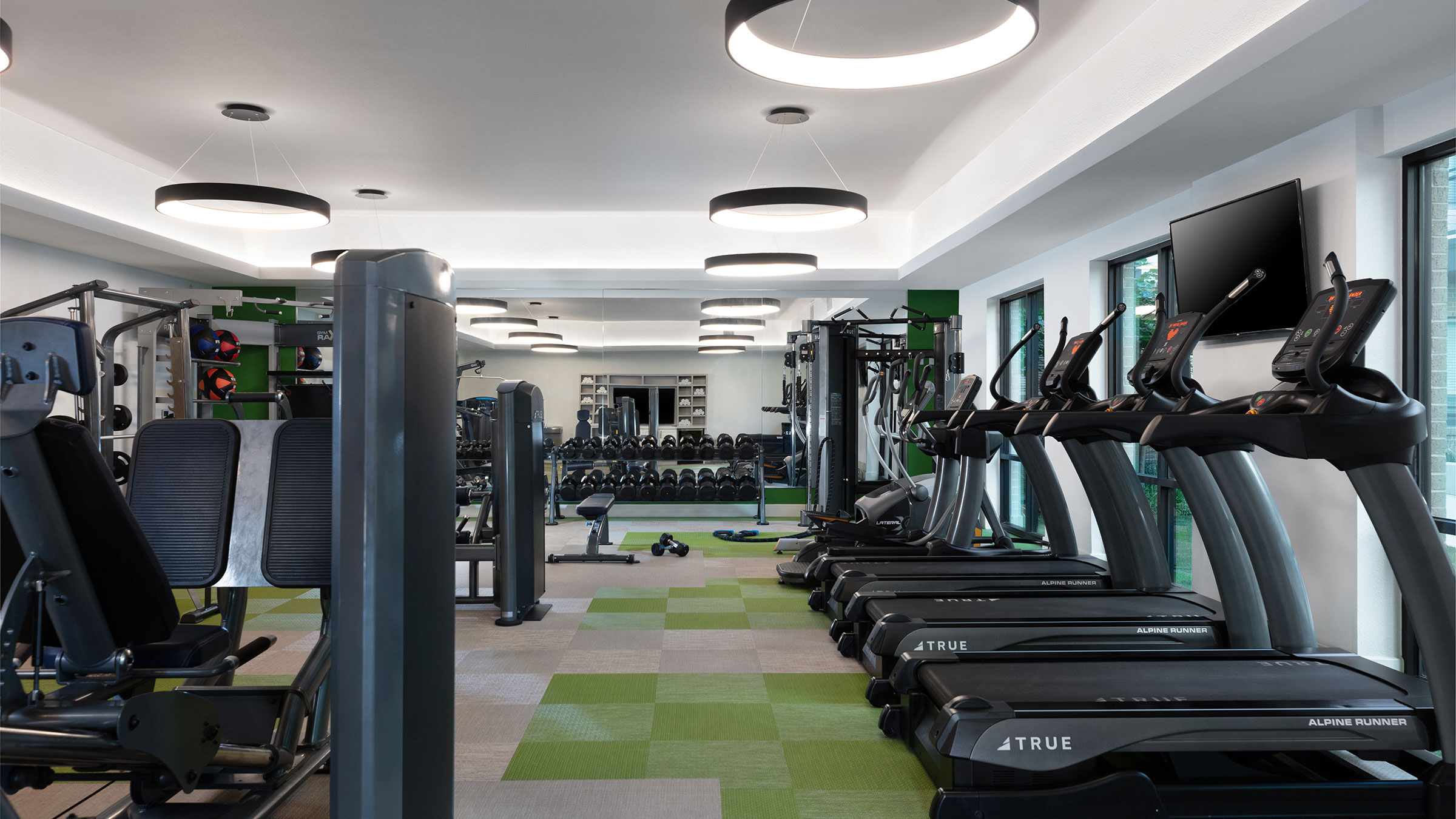 a large room with exercise equipment