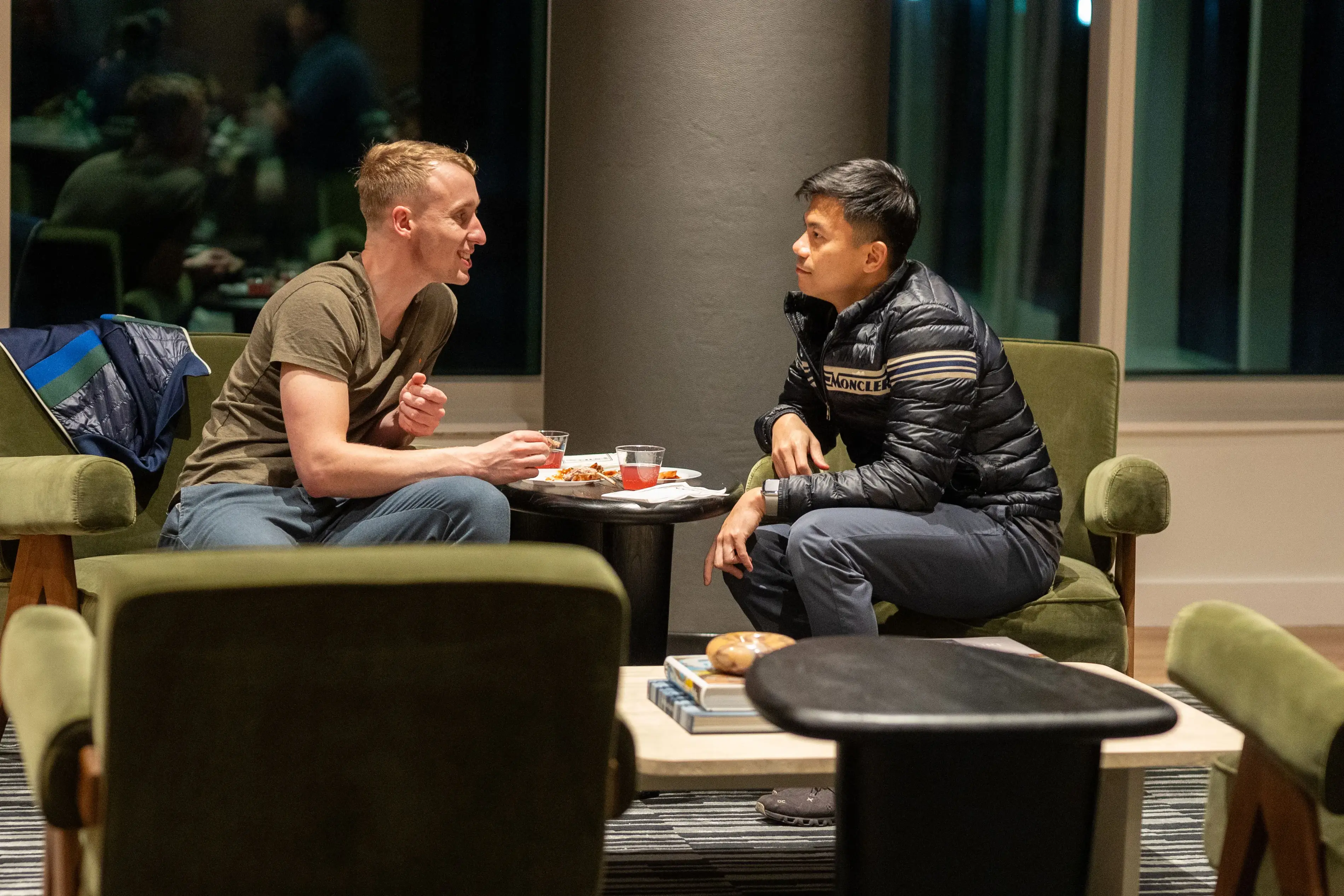 two men sitting at a table
