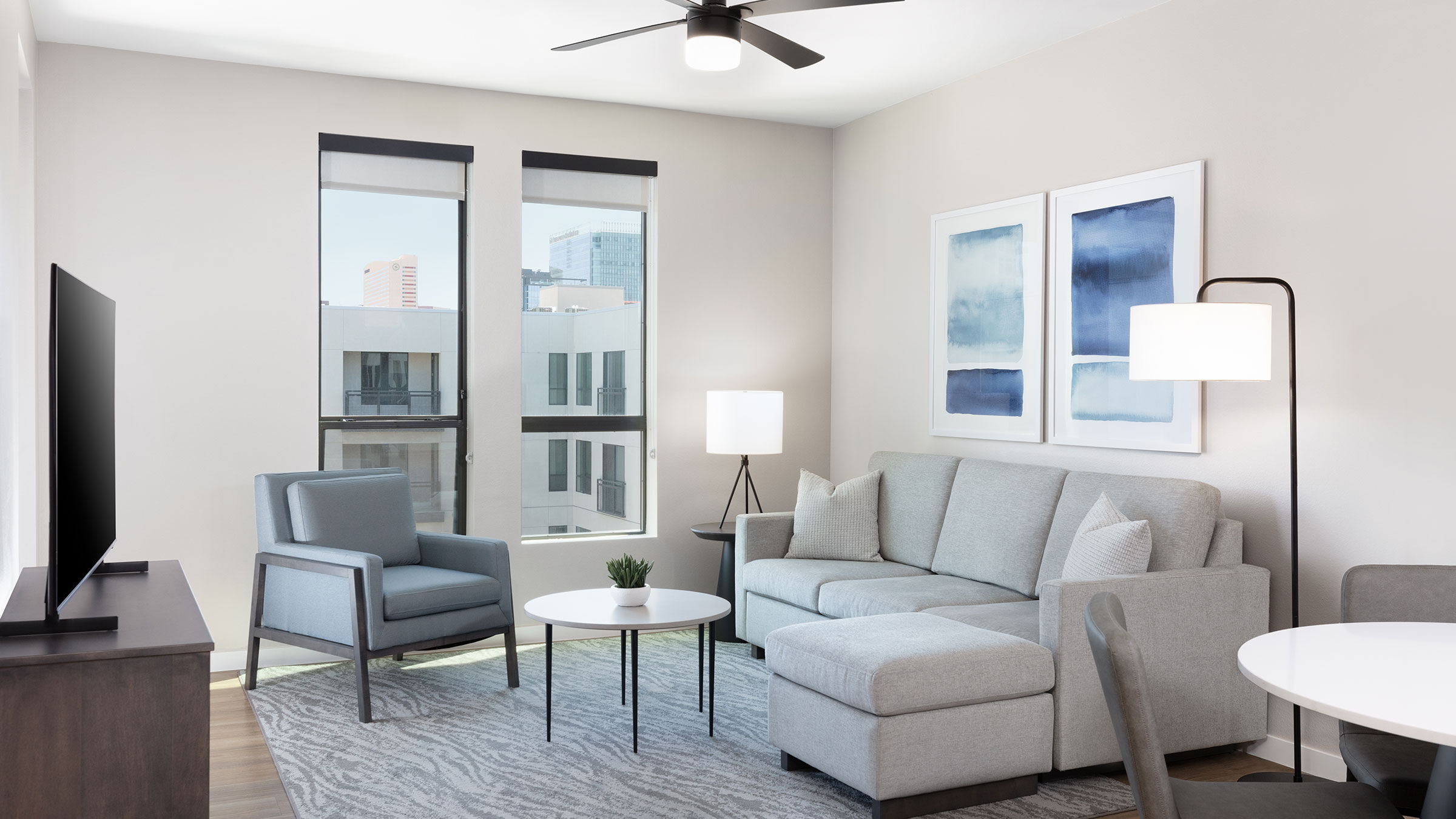 a living room with a couch and chairs