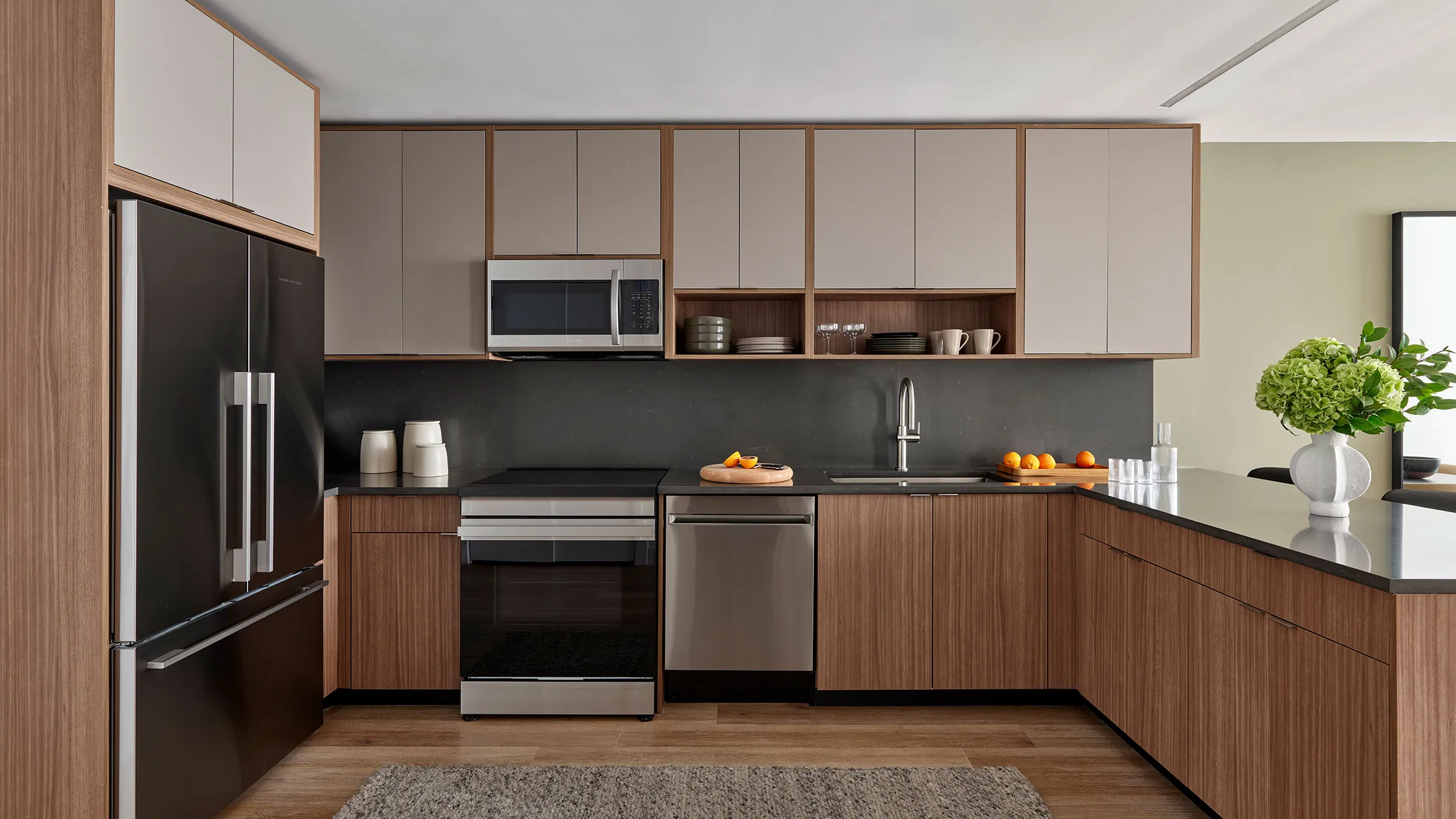 a kitchen with wood cabinets and appliances
