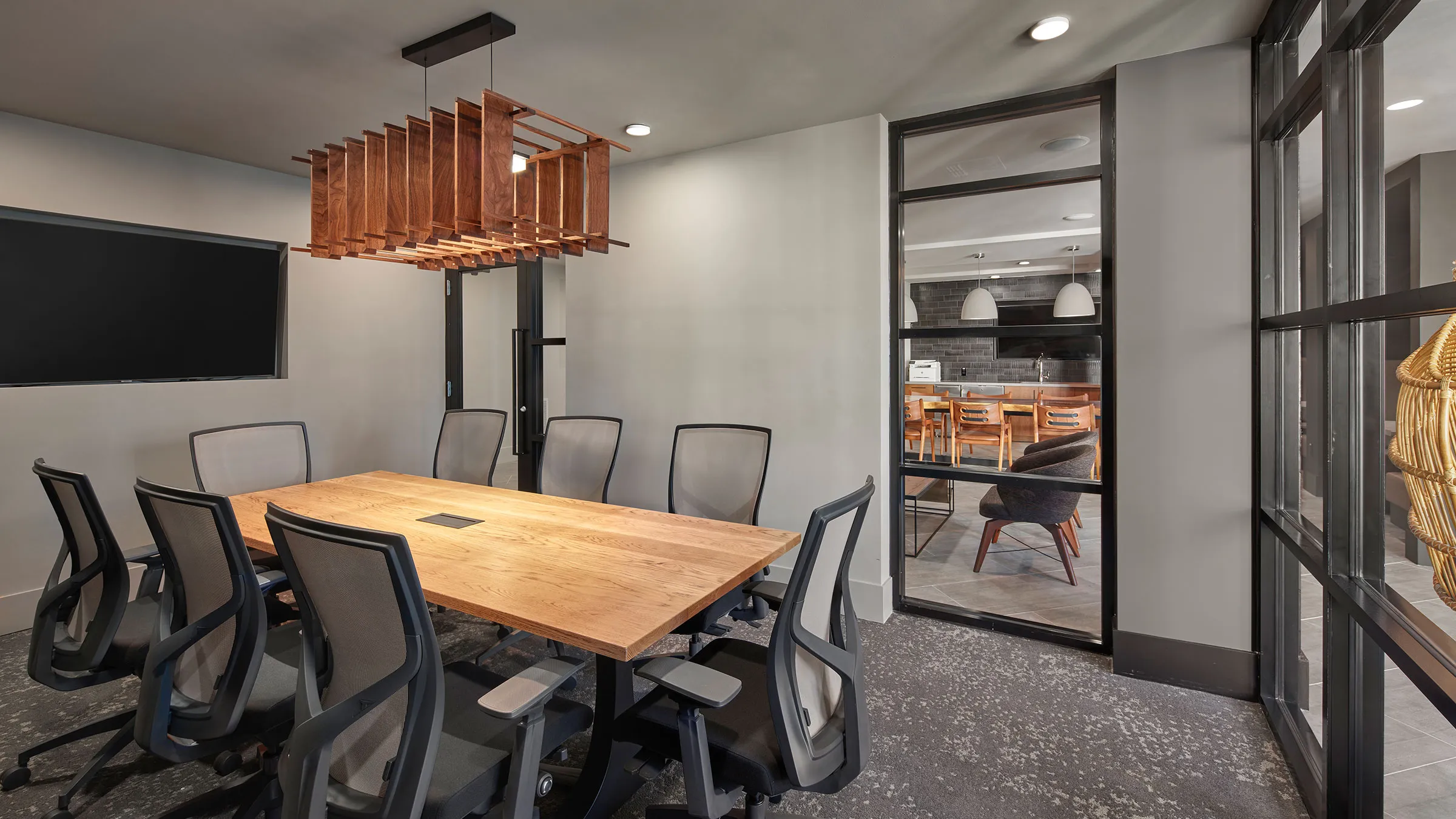 a conference room with a table and chairs