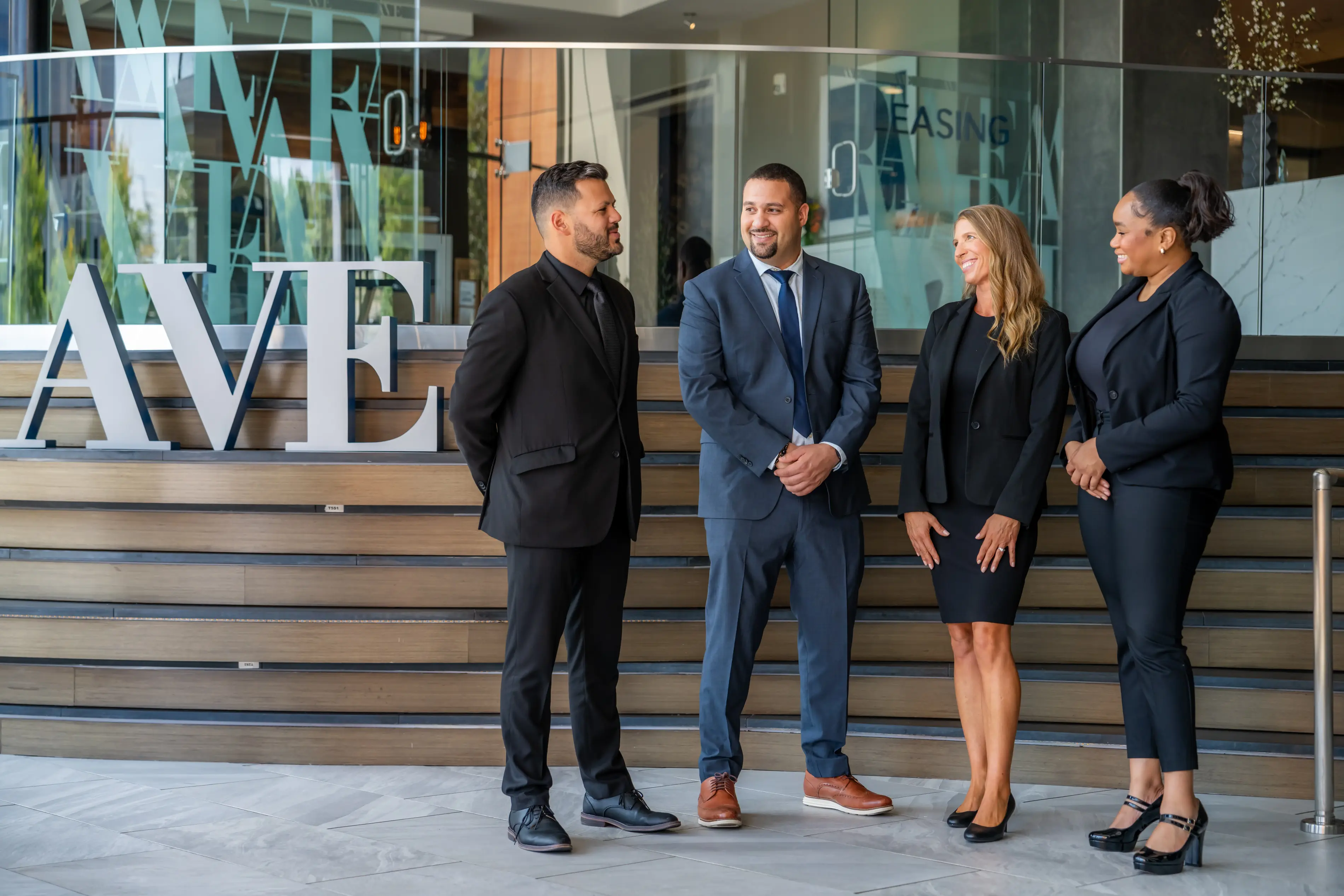 AVE team standing in front of AVE King of Prussia lobby