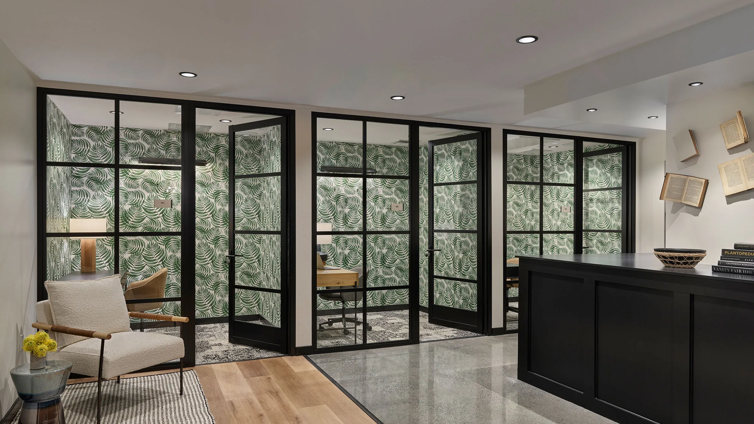 a room with glass doors and a desk