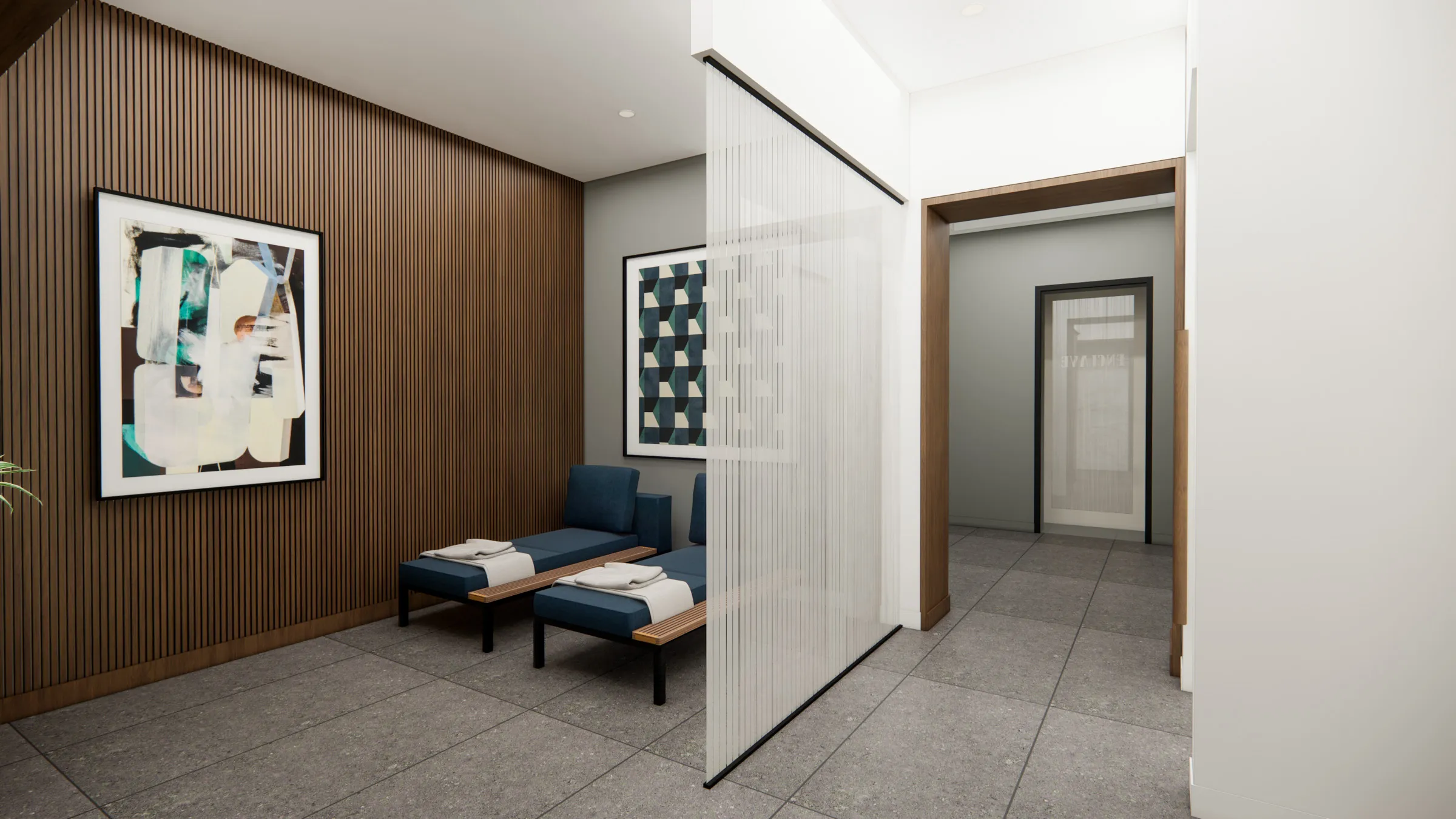 a room with a couple of chairs and a glass partition