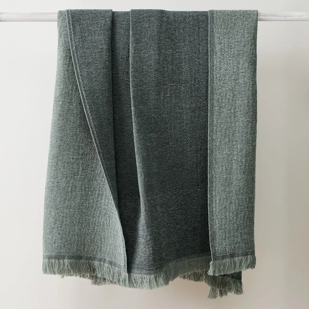 a grey blanket on a white bar