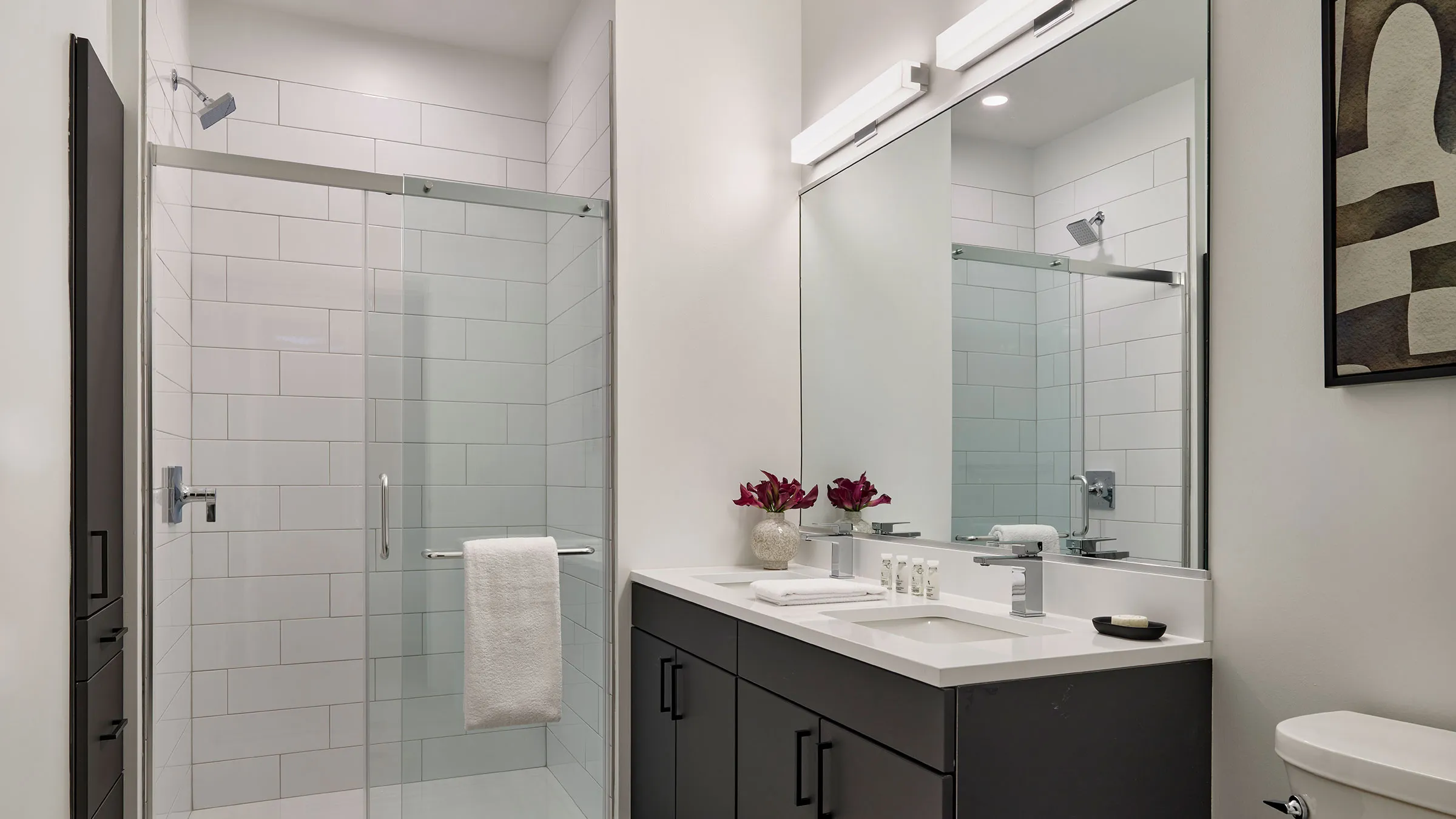 a bathroom with a shower and sink