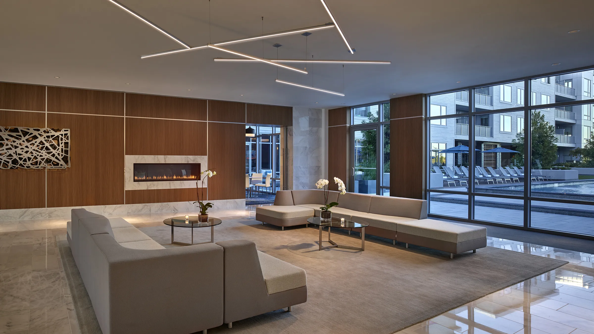 a large room with a fireplace and couches