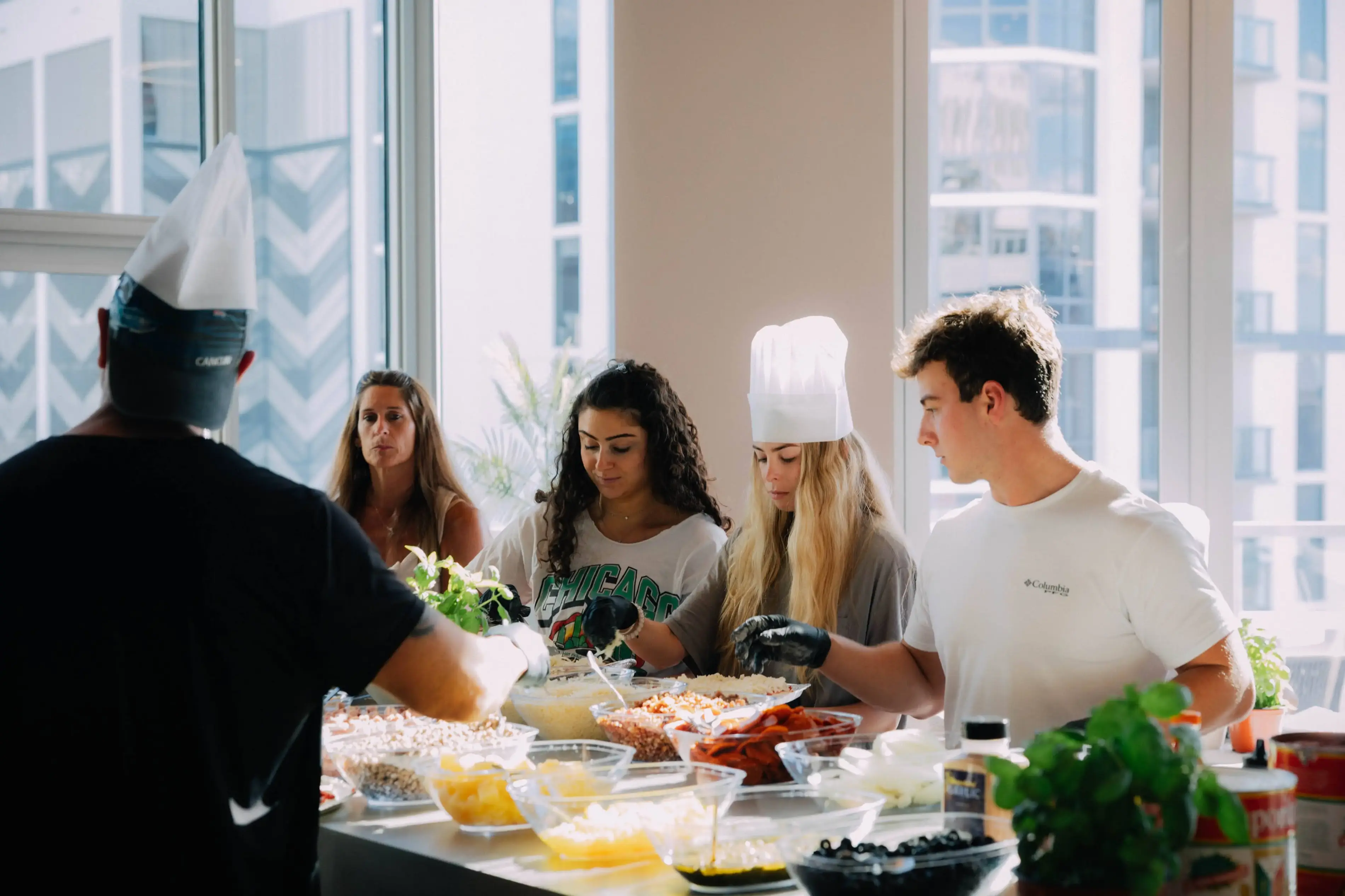 a group of people in a kitchen