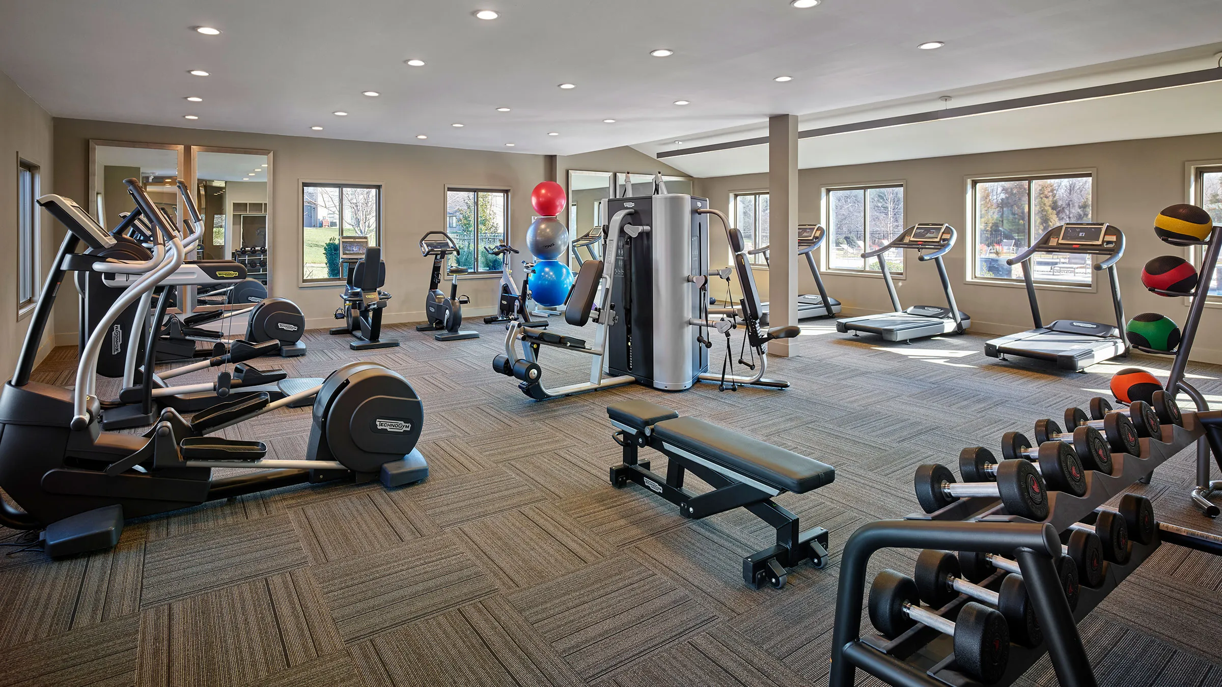 a large room with exercise equipment
