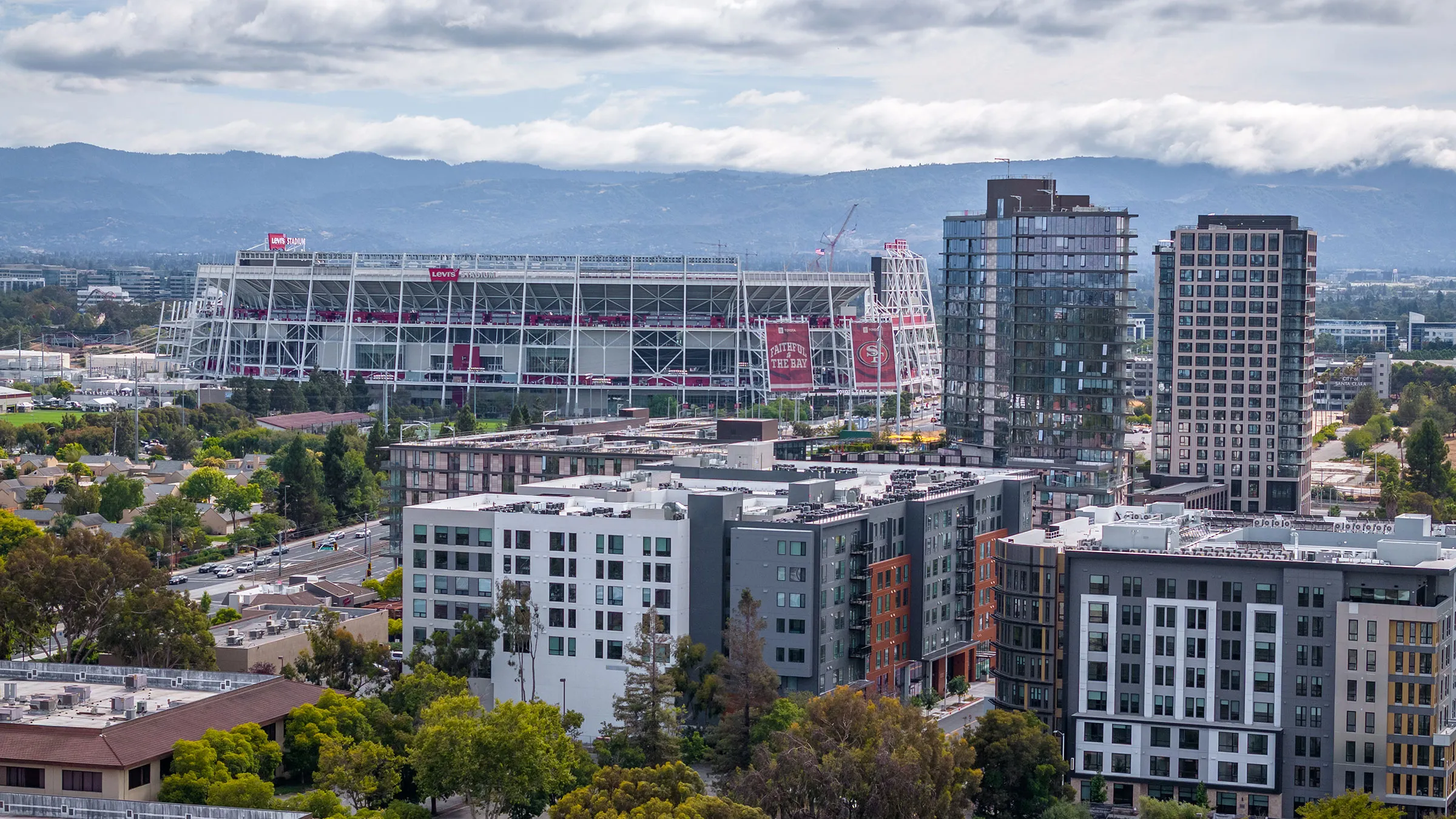 a city with a stadium and buildings
