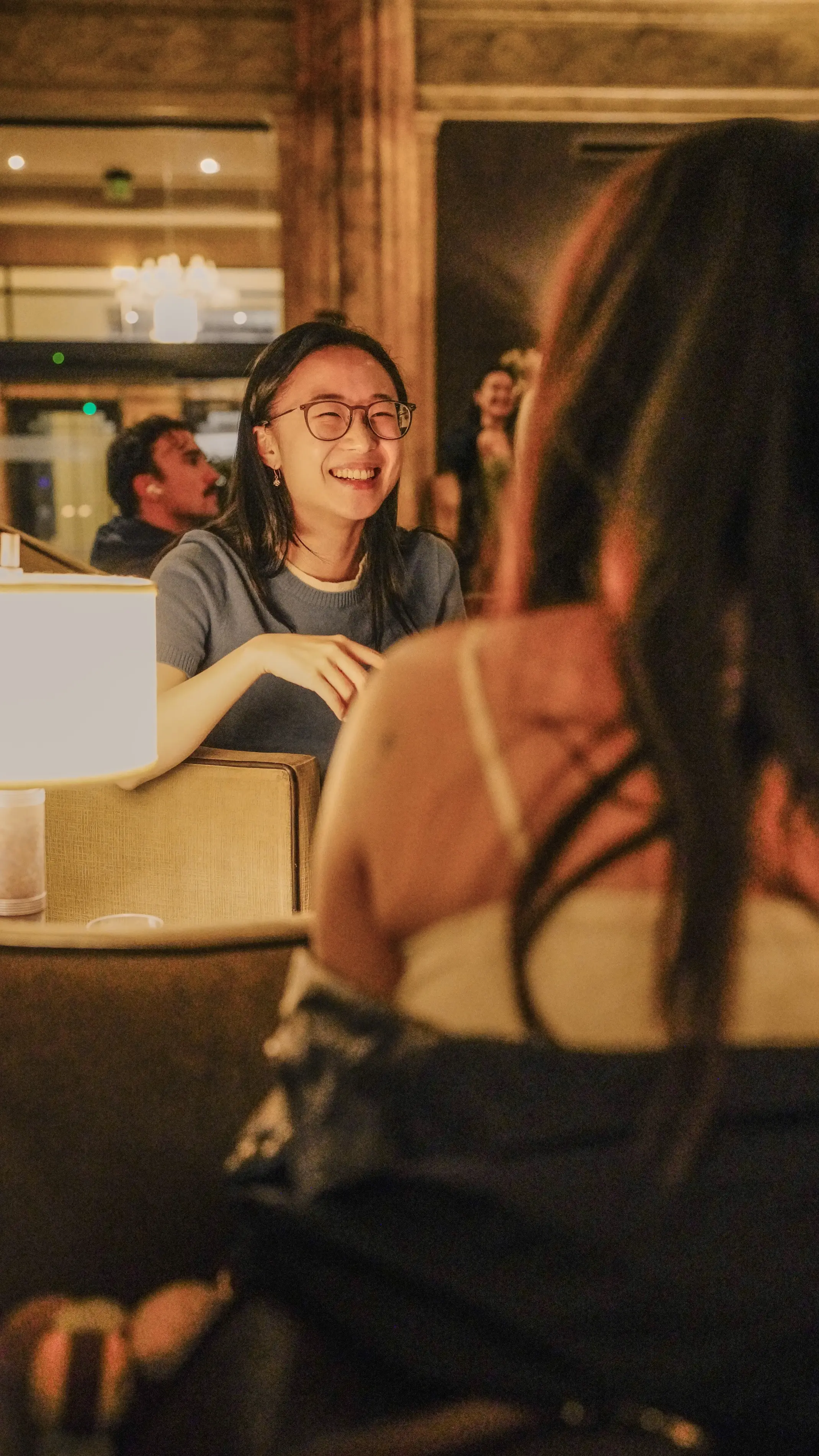 a woman laughing at another woman