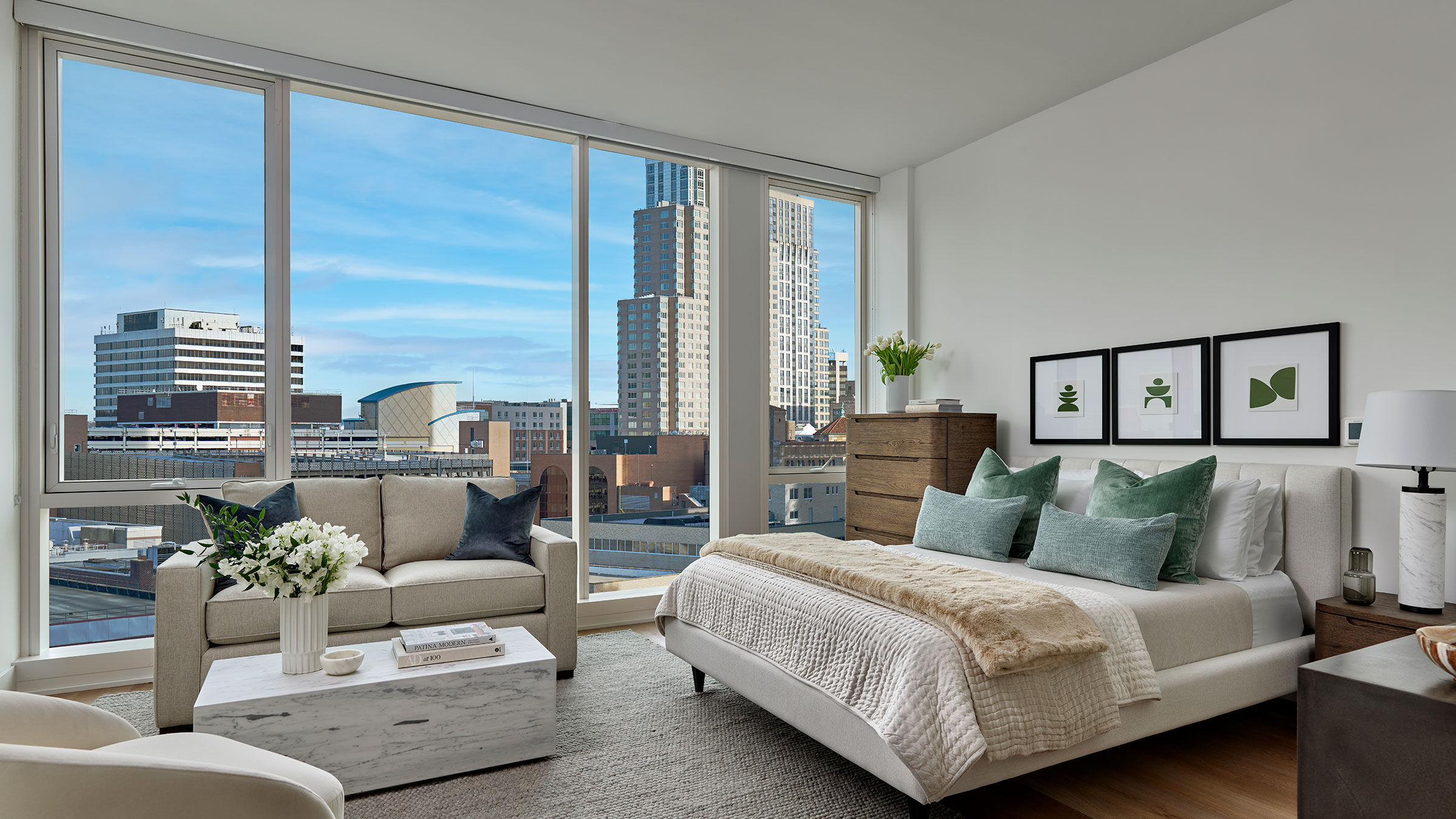 a bedroom with a large window