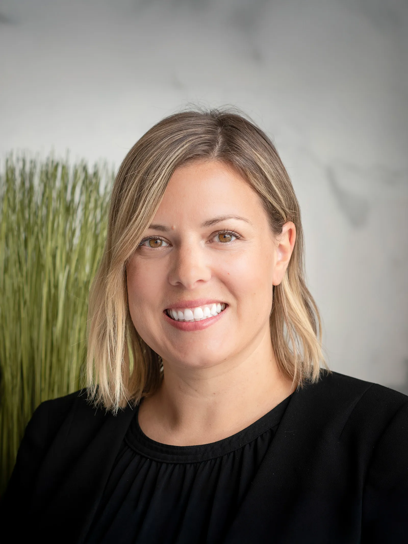 a woman smiling at camera