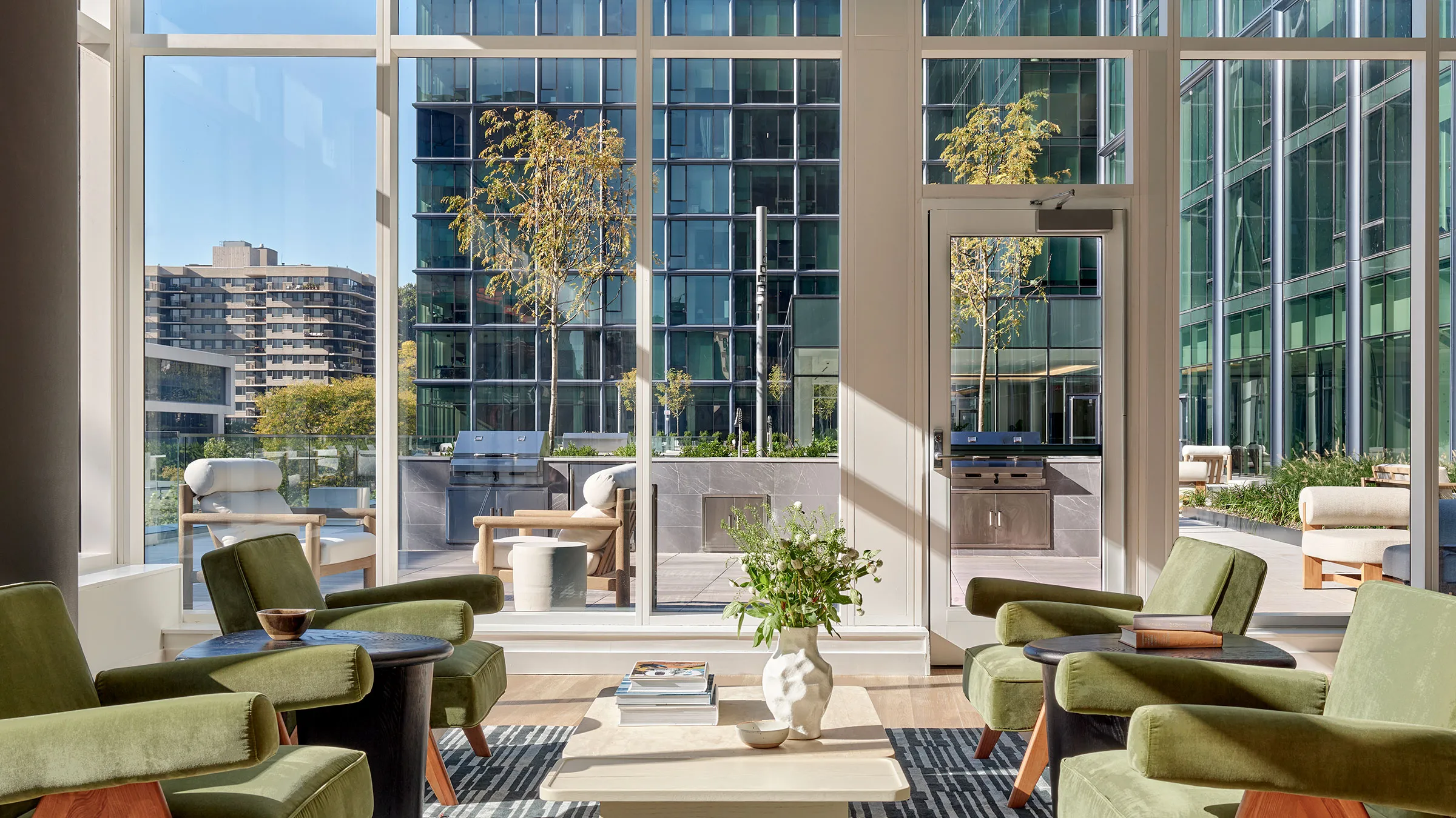 a room with green chairs and a coffee table