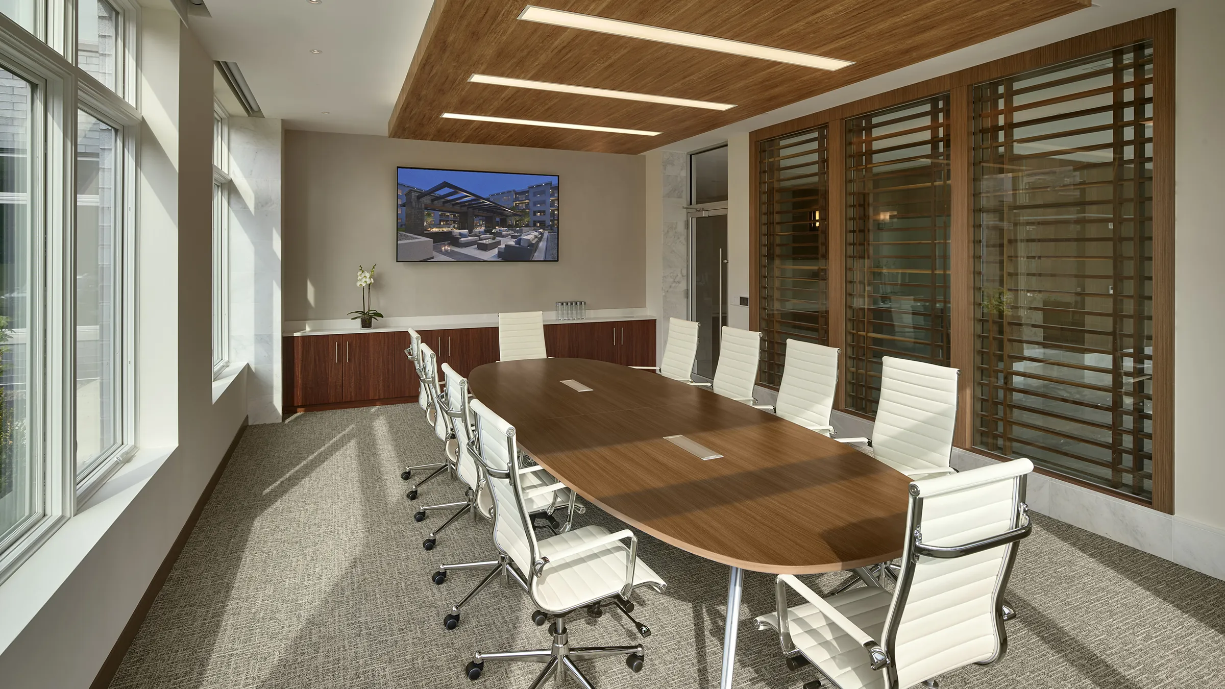 a conference room with a table and chairs