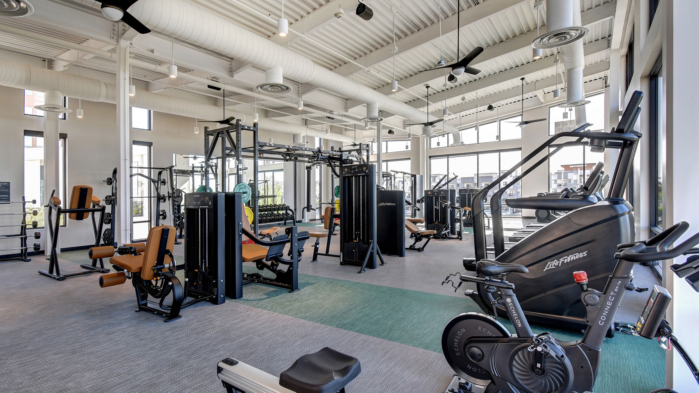 a large gym with exercise equipment