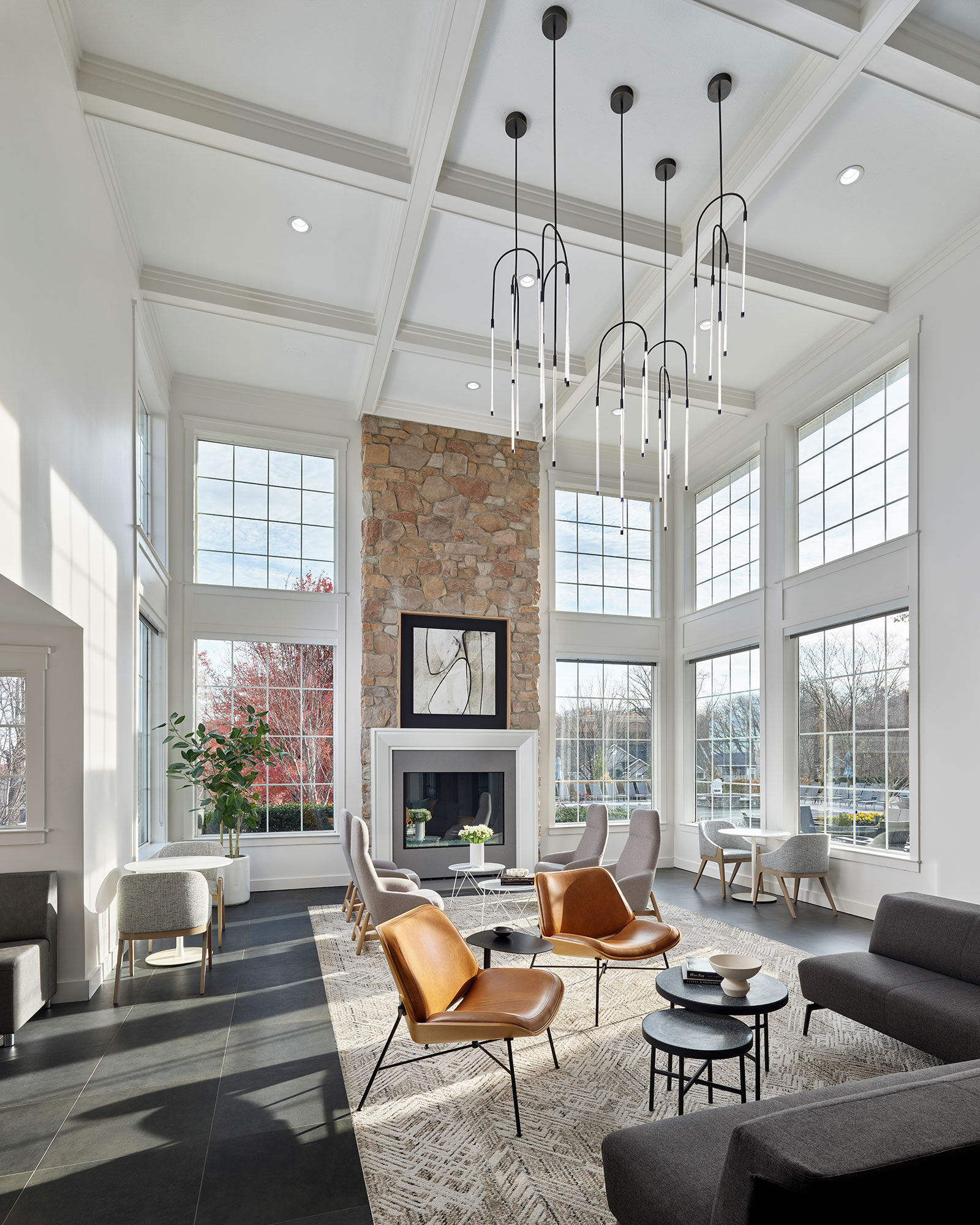 a room with a fireplace and chairs