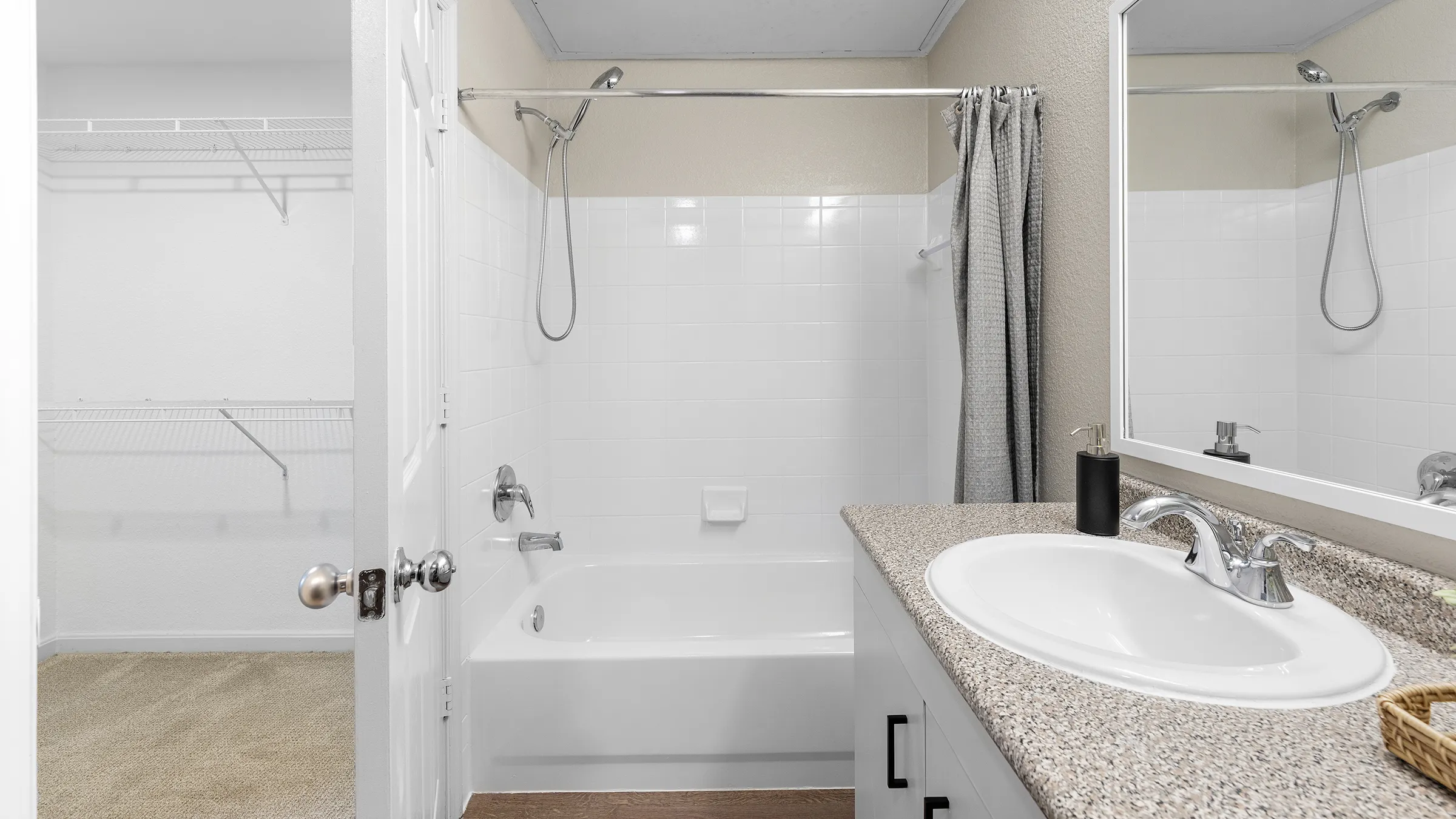 a bathroom with a sink and shower