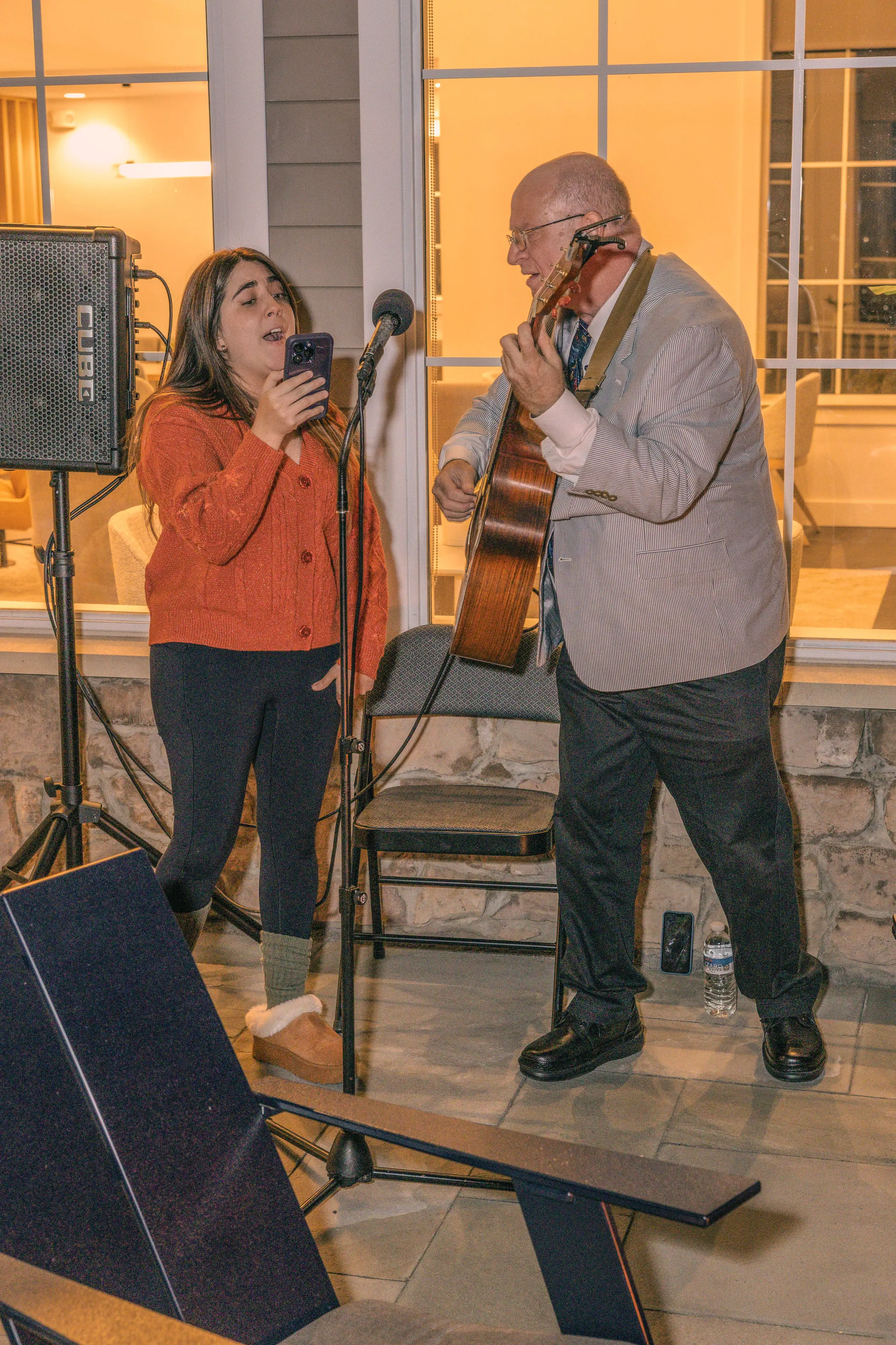 a man and woman playing instruments