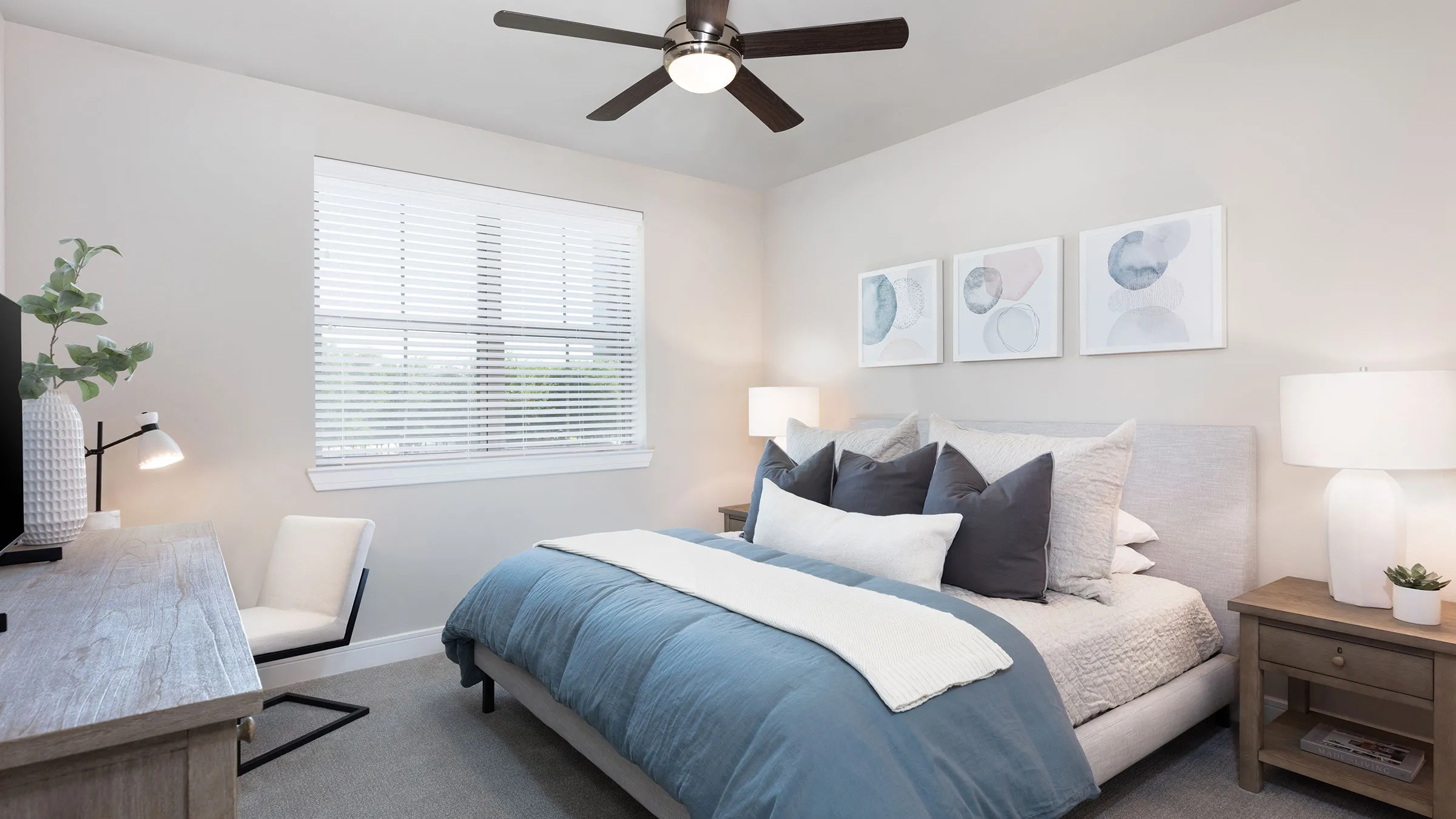 a bedroom with a fan and a bed