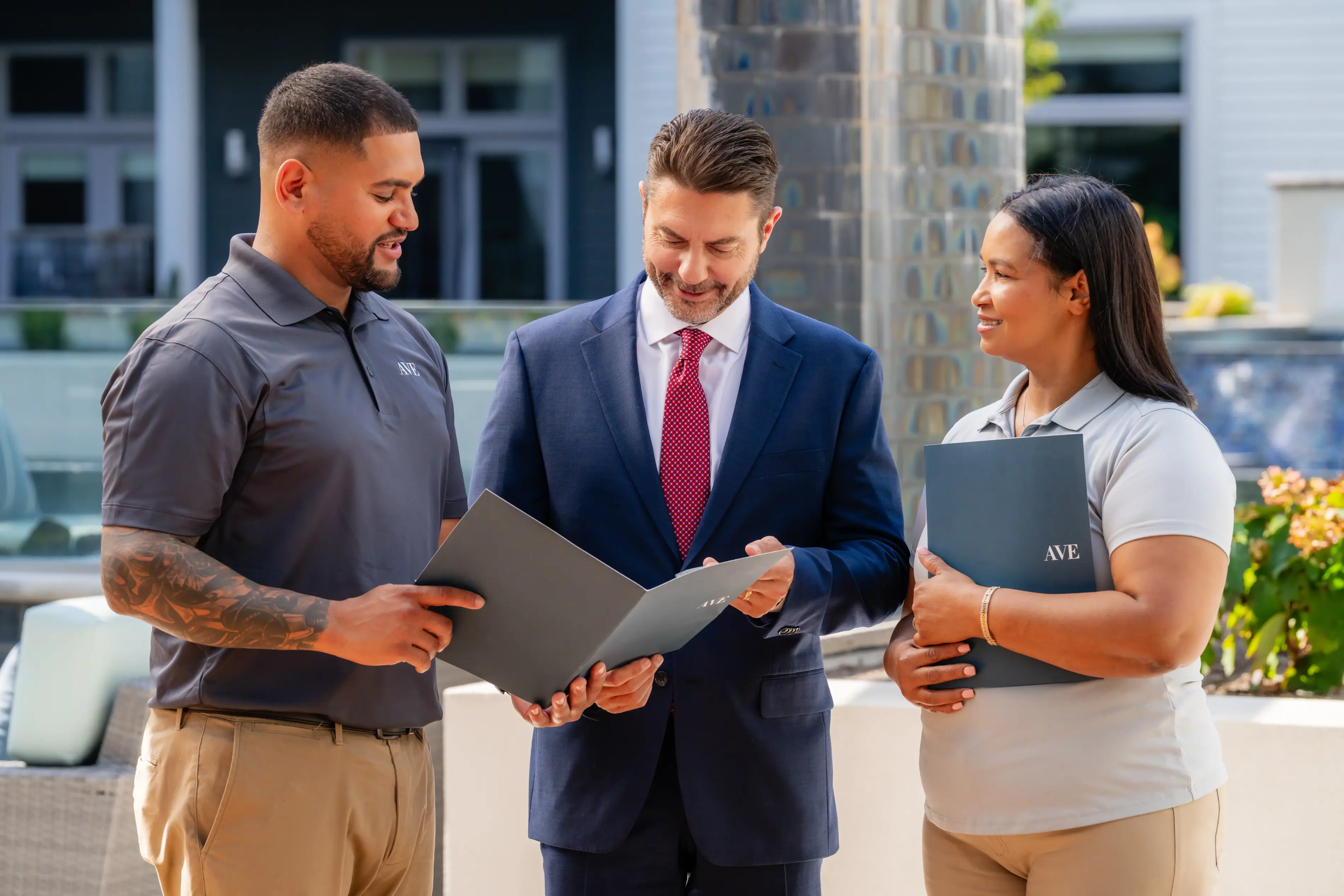 AVE team looking at folders
