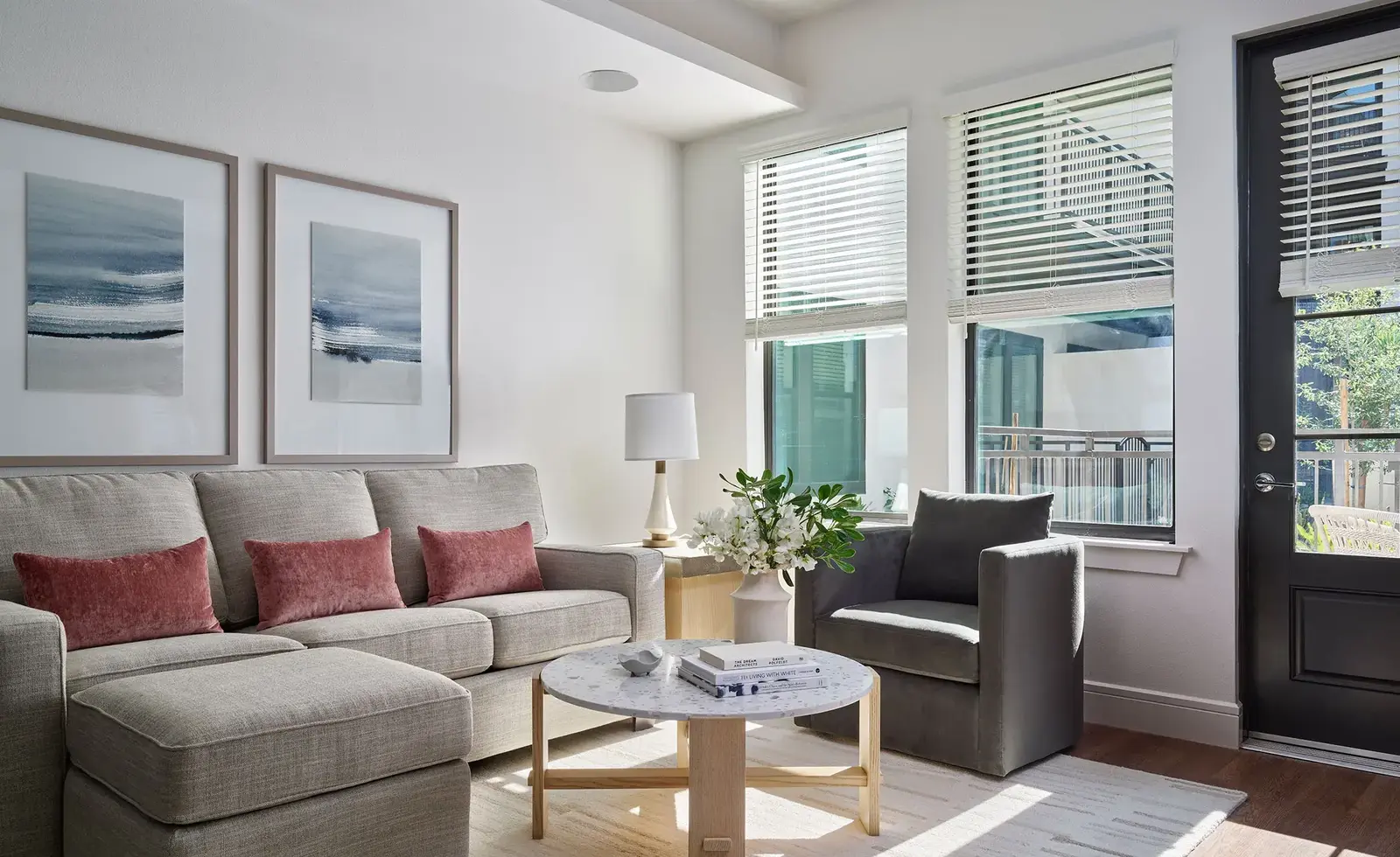 Furnished apartment living area shown — representative home at AVE Paradise Valley.