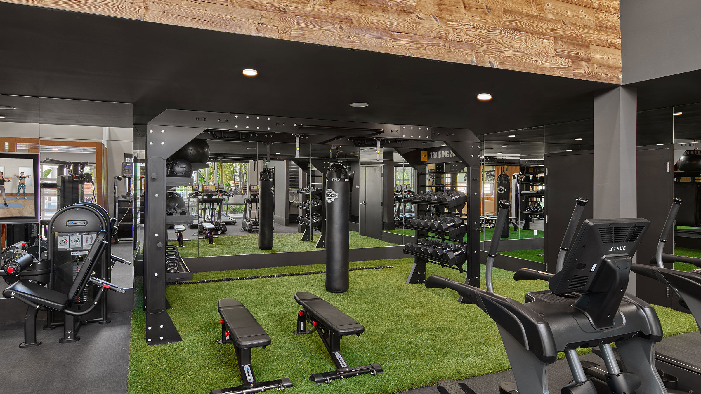 a gym with a mirror and exercise equipment