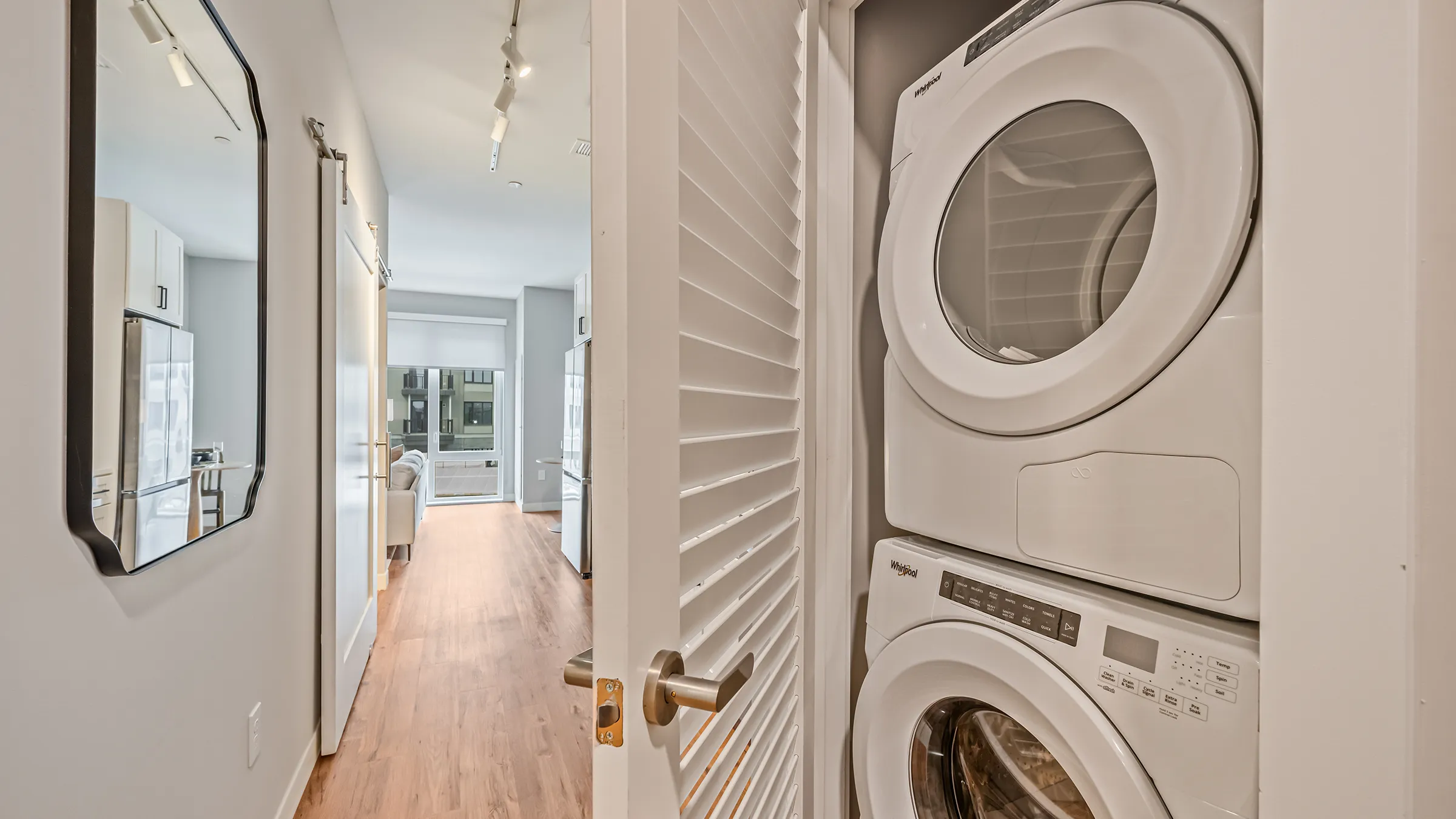 a laundry room with a door open