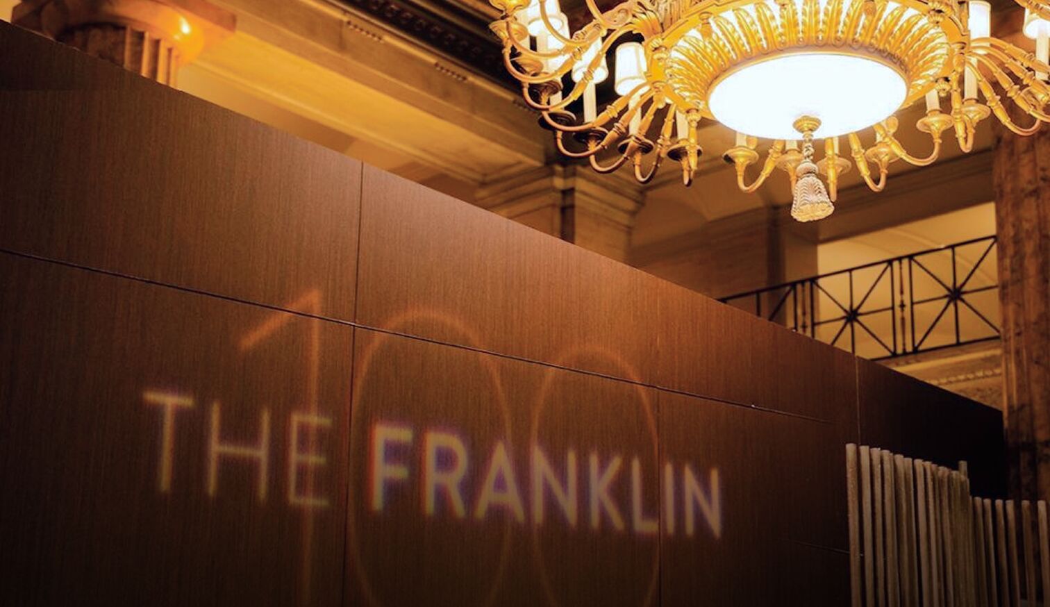 A projector that reads "The Franklin 100"