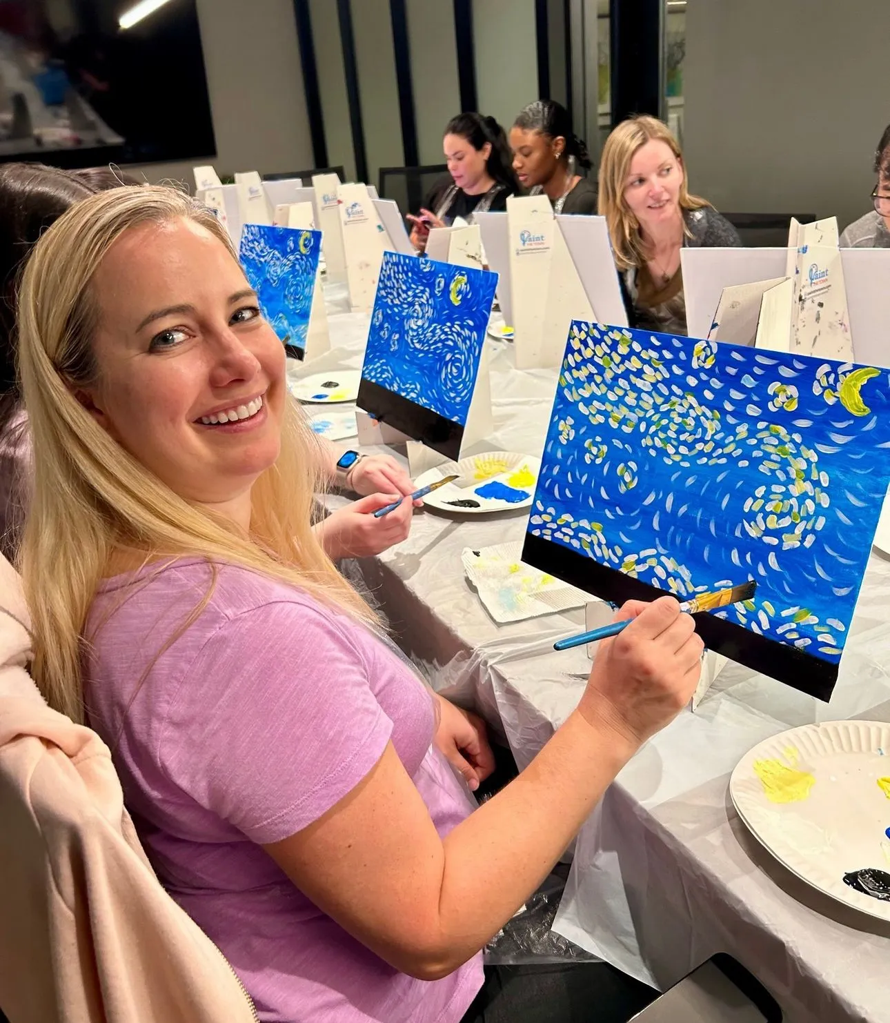 a woman painting a picture