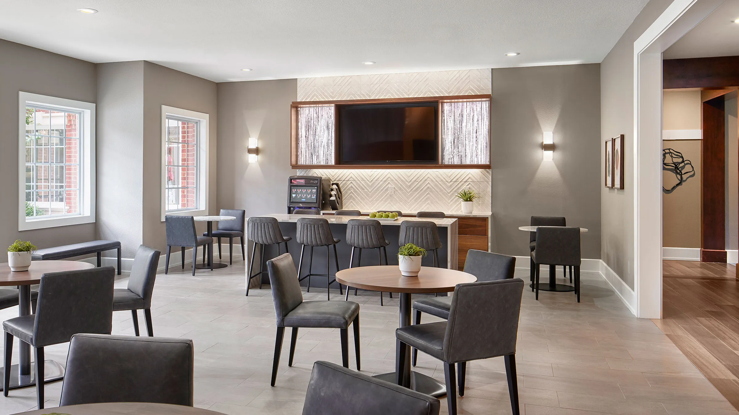 a room with a television and tables