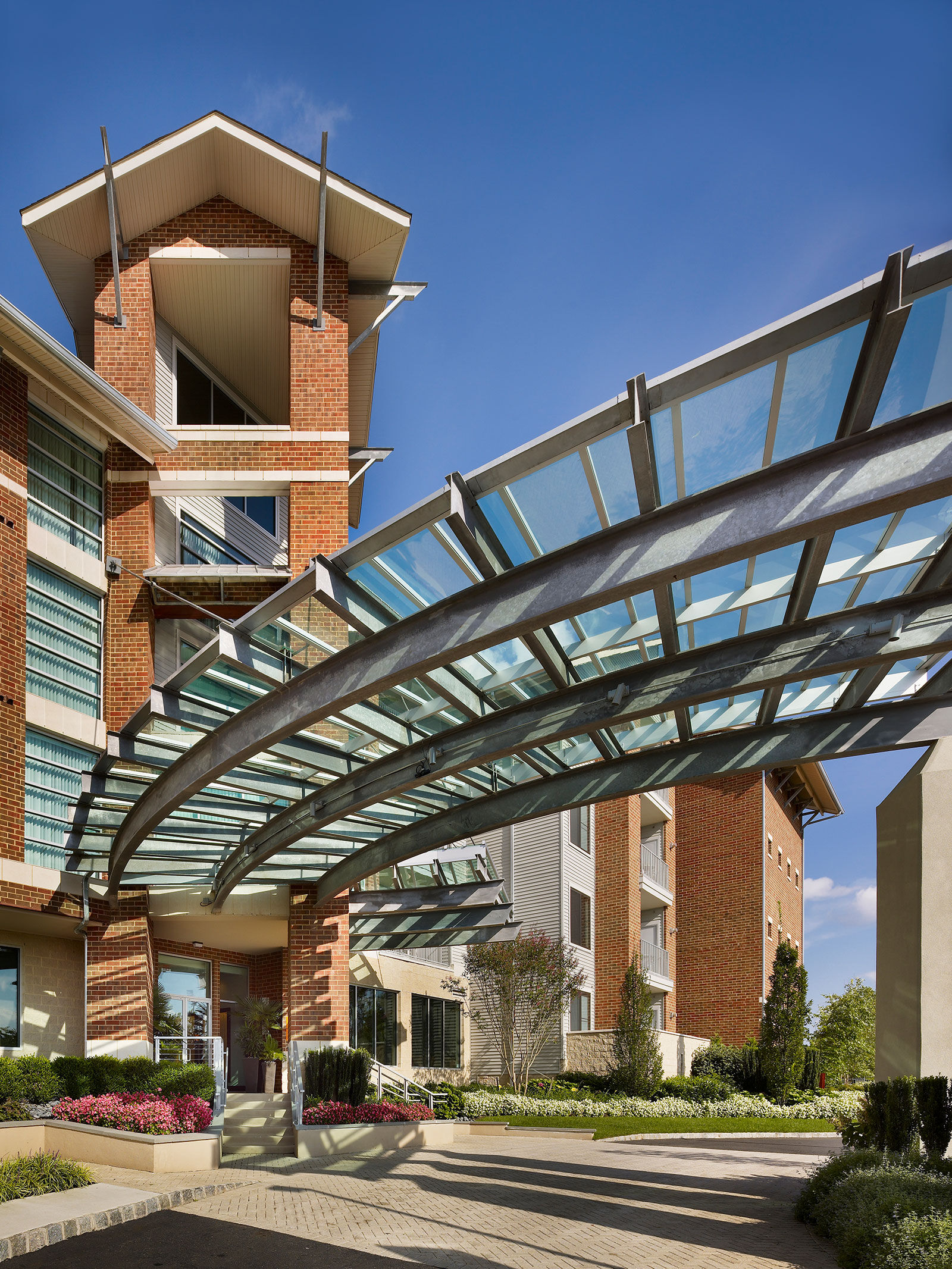 a glass covered walkway over a building