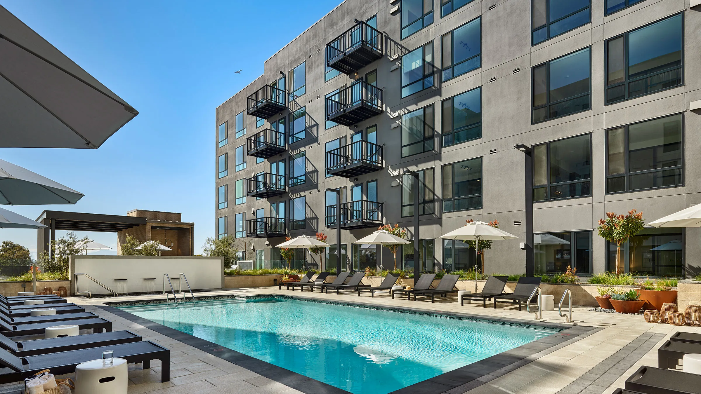a swimming pool in front of a building