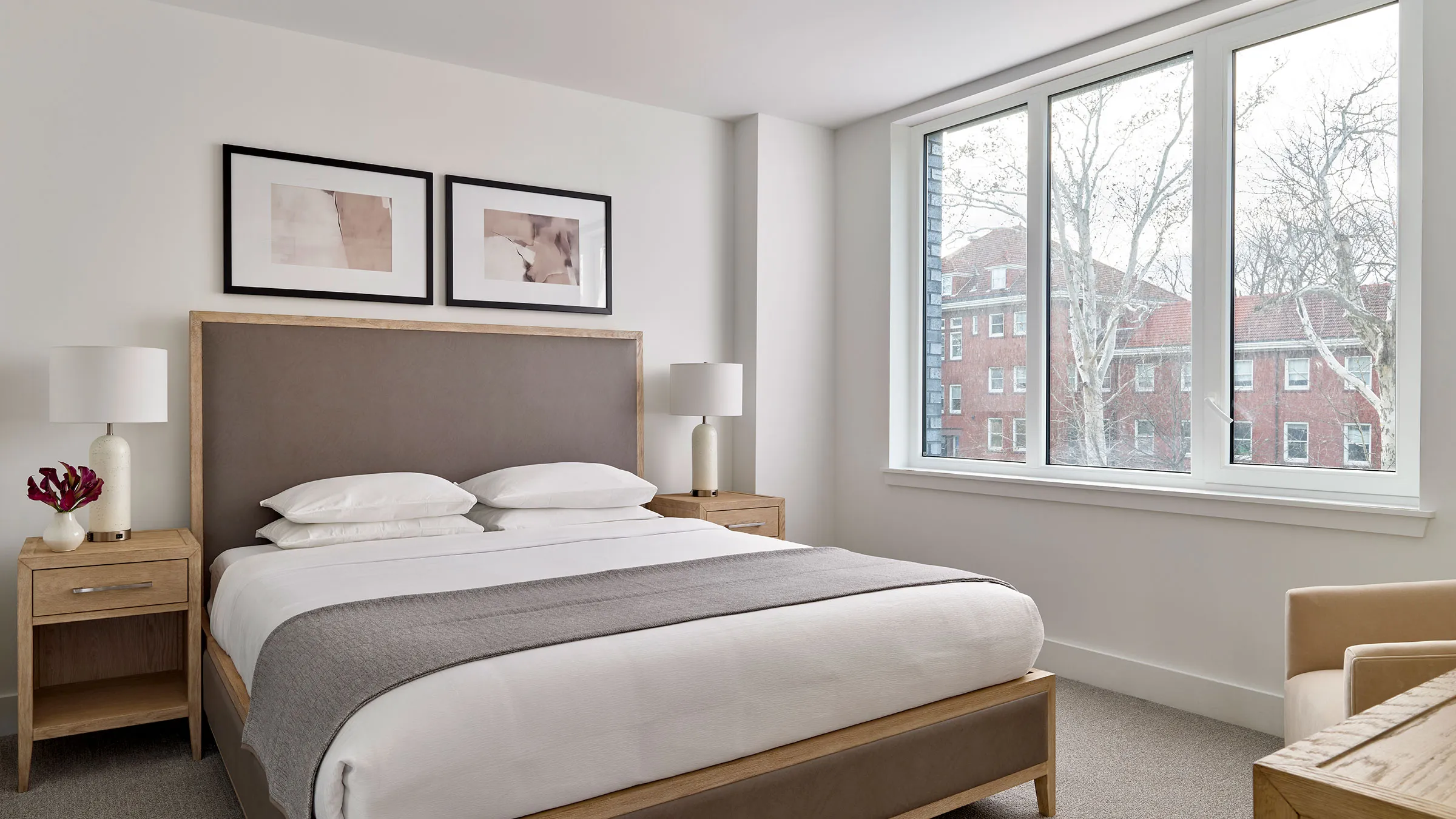 a bed with a lamp and a window