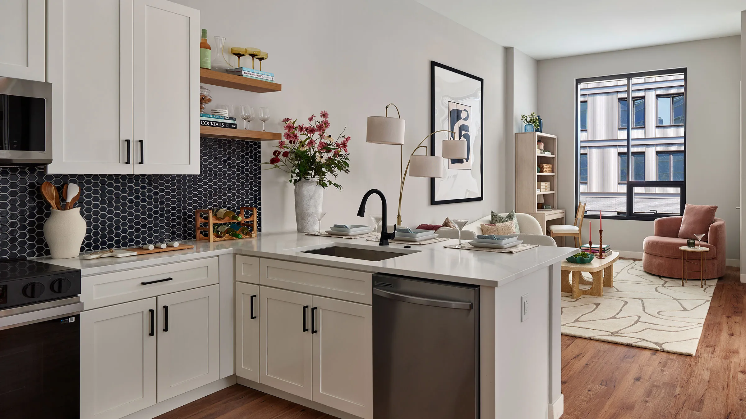 a kitchen with white cabinets and a sink
