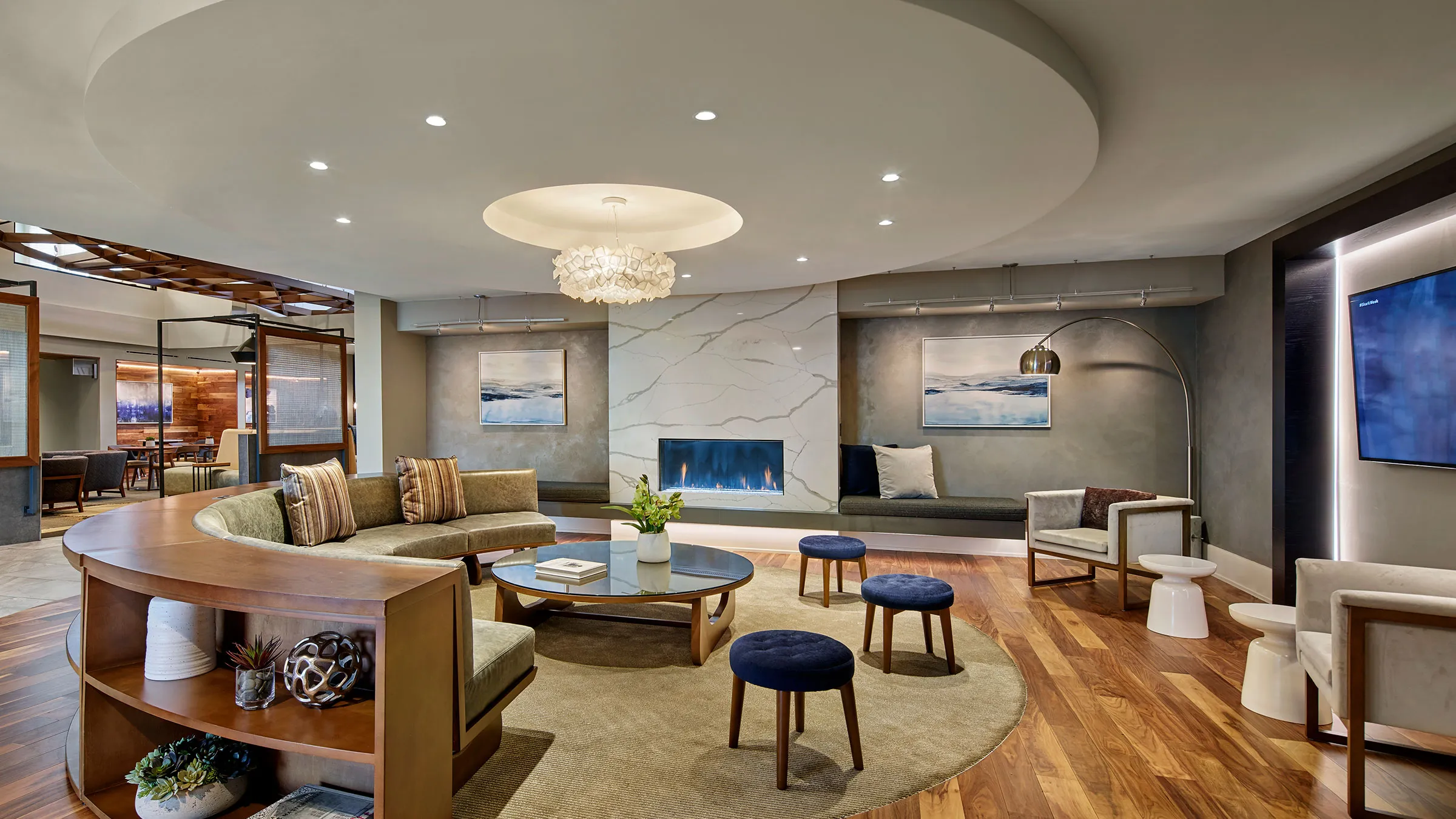 a room with a fireplace and couches