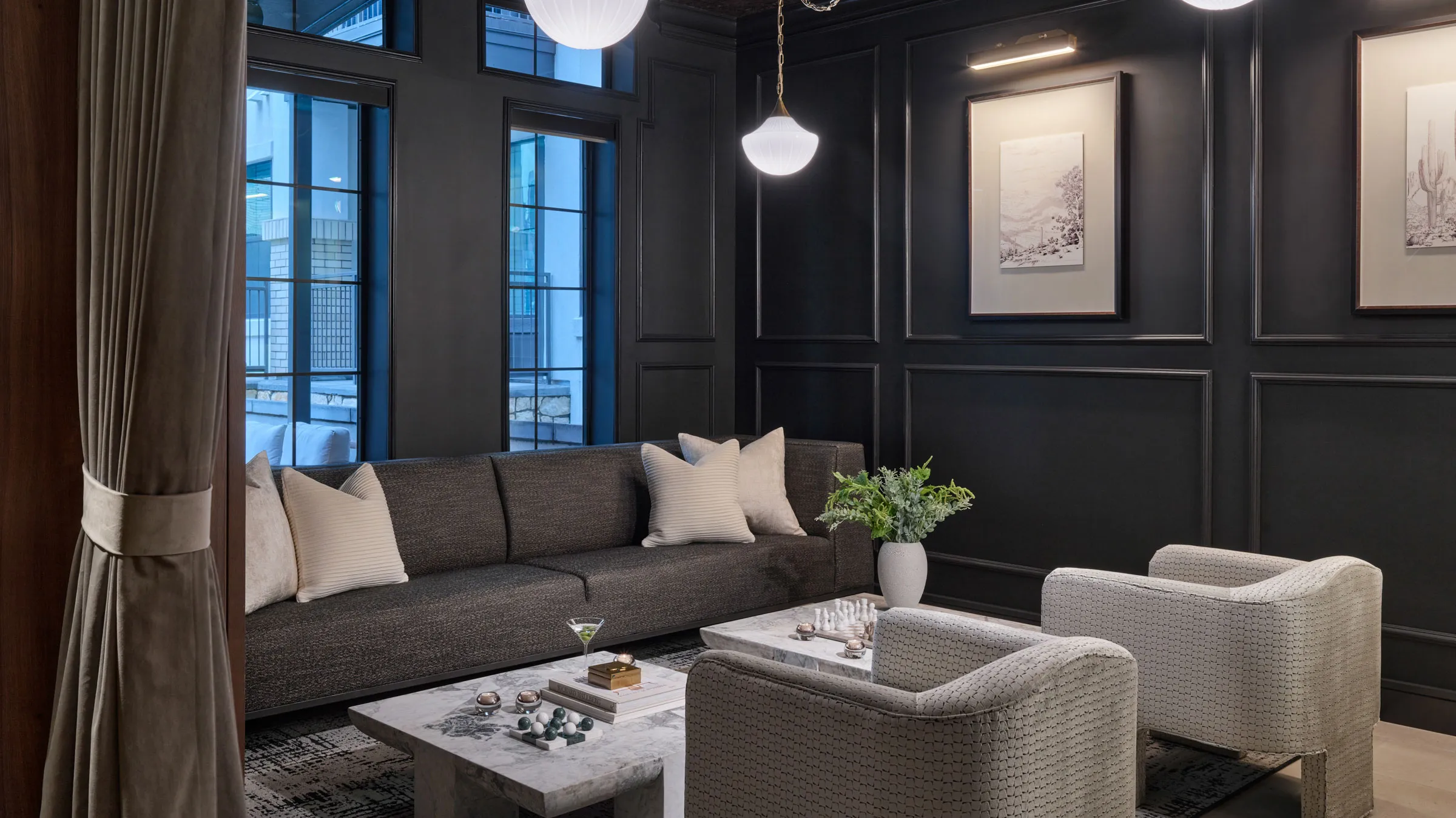 a living room with a couch and chairs