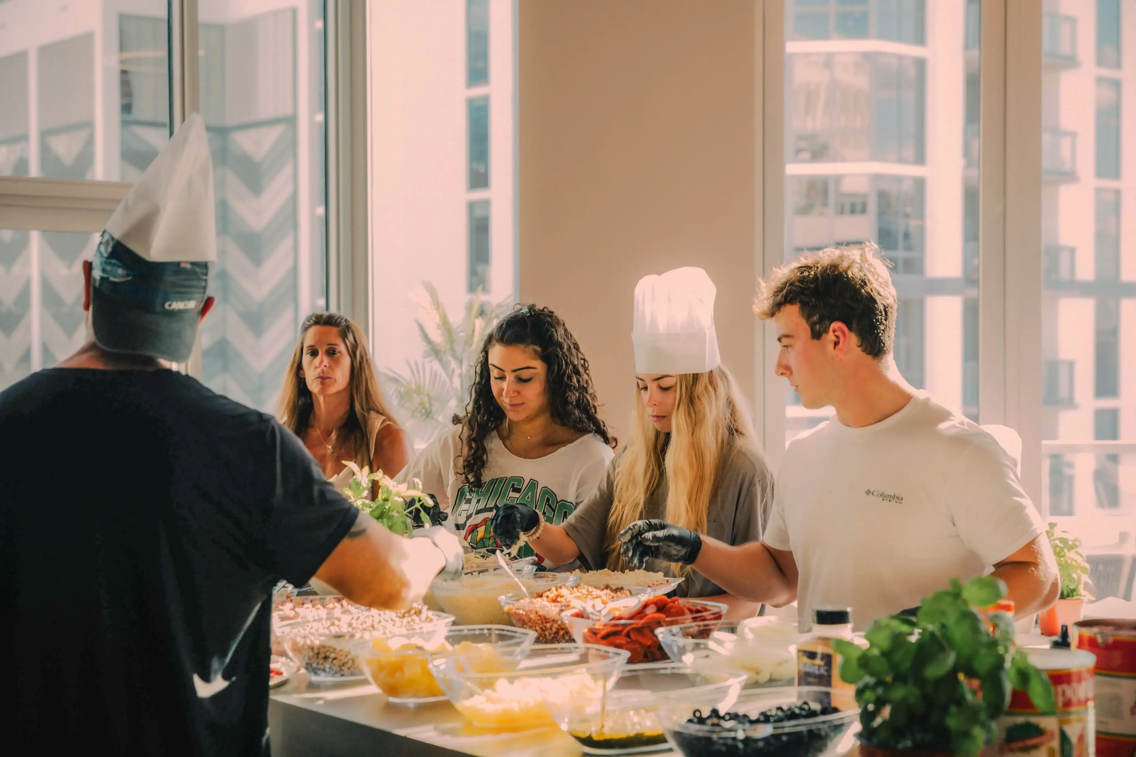 a group of people in a kitchen