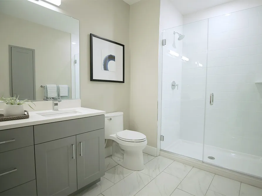 a bathroom with a shower and sink