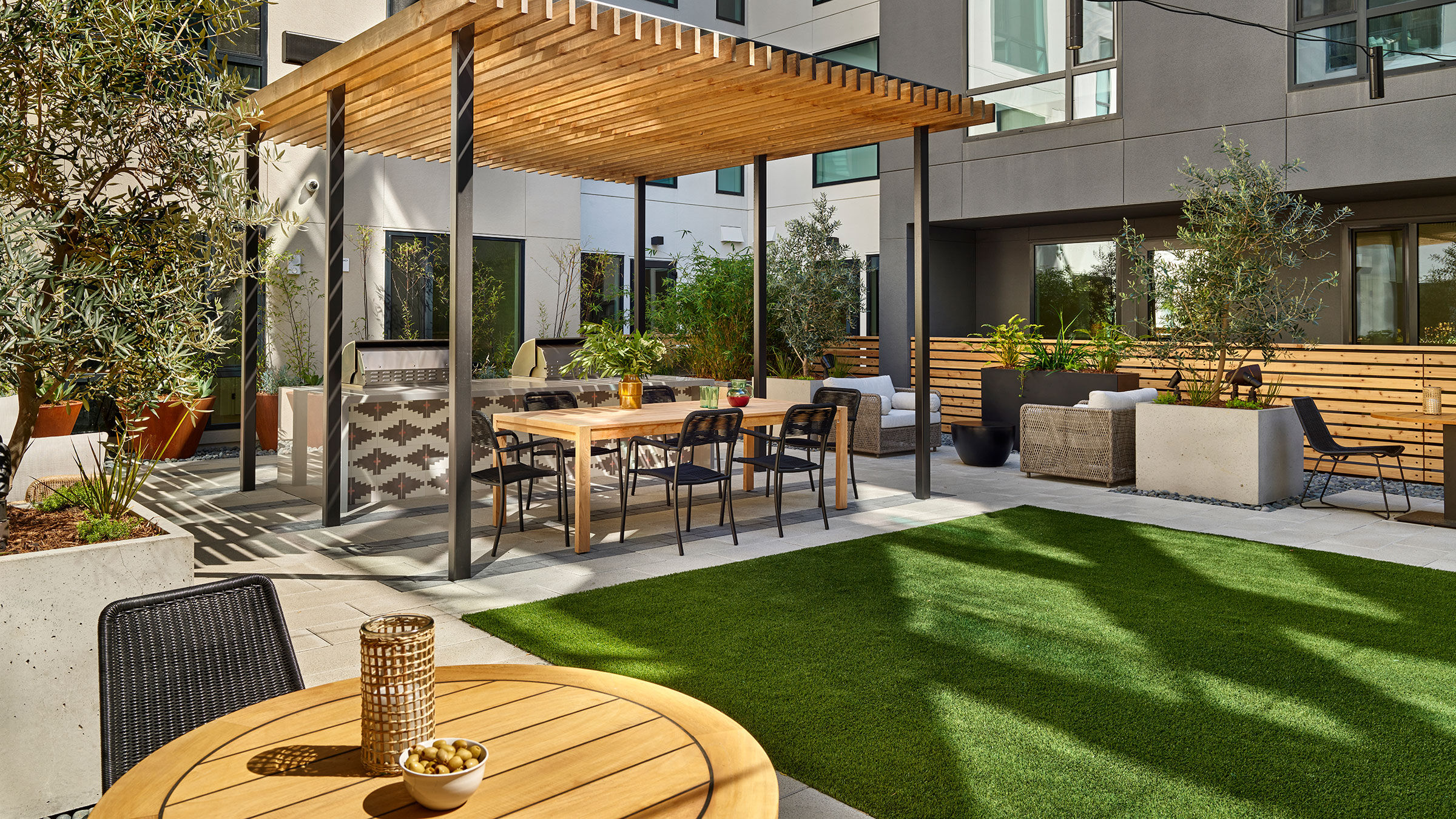 a patio with a table and chairs