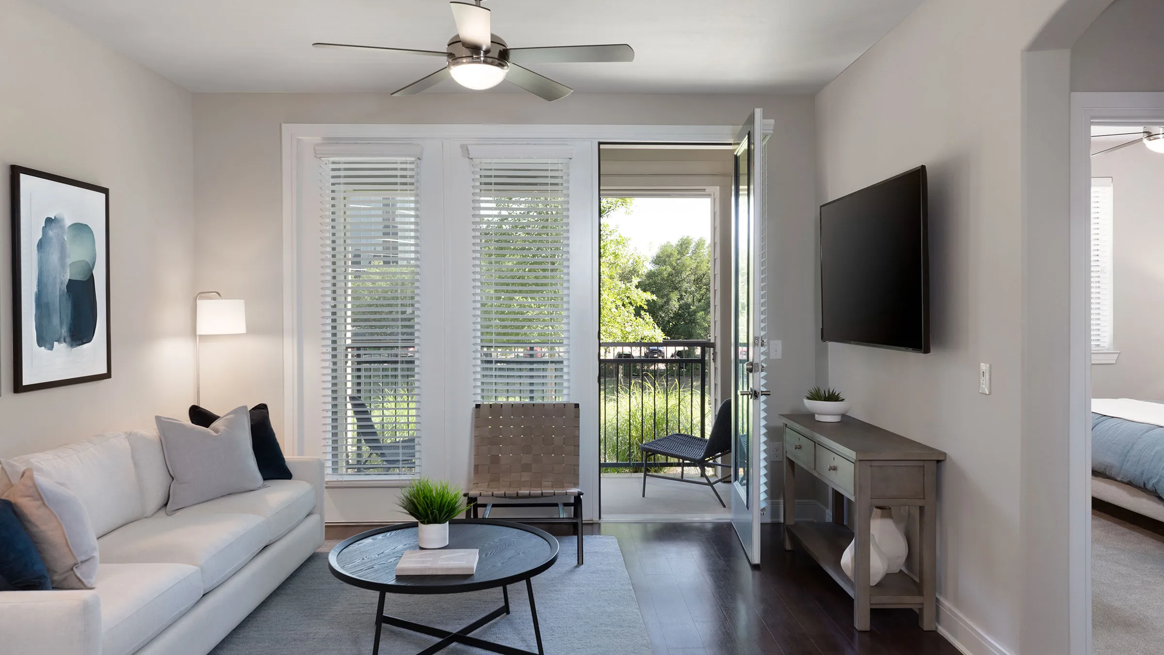 a living room with a television and a couch