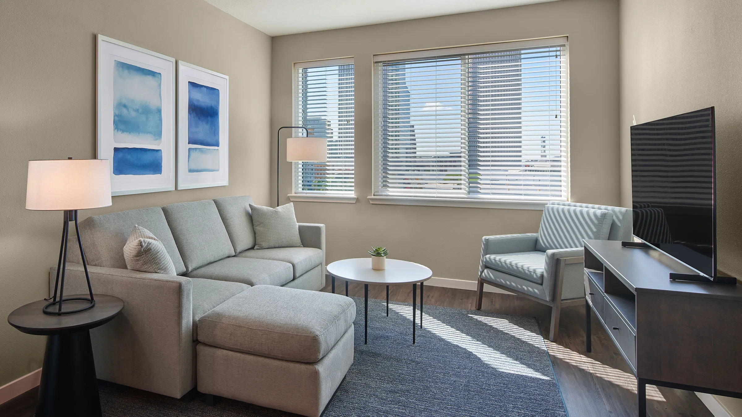a living room with a couch and chairs