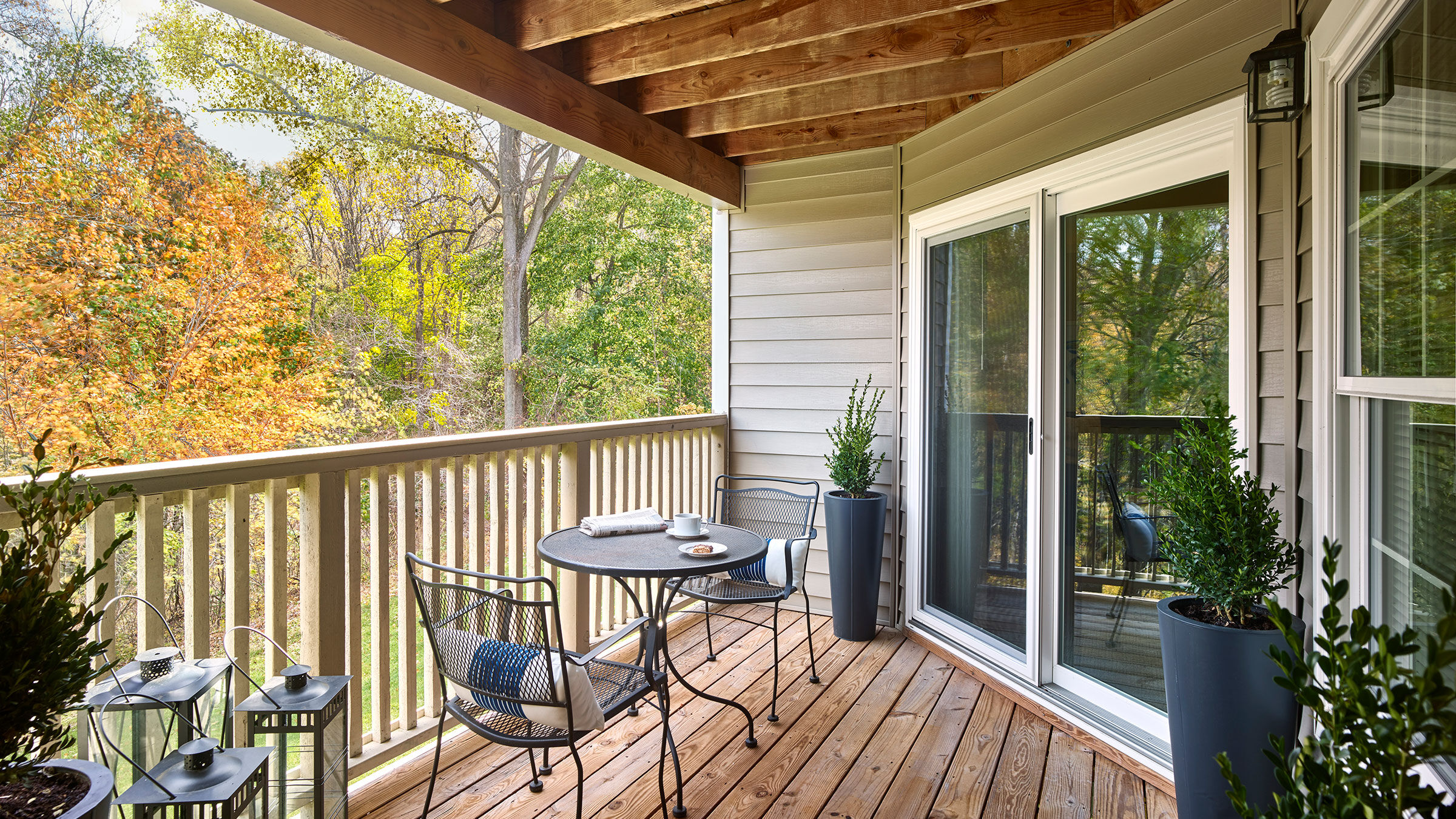 a patio with a table and chairs