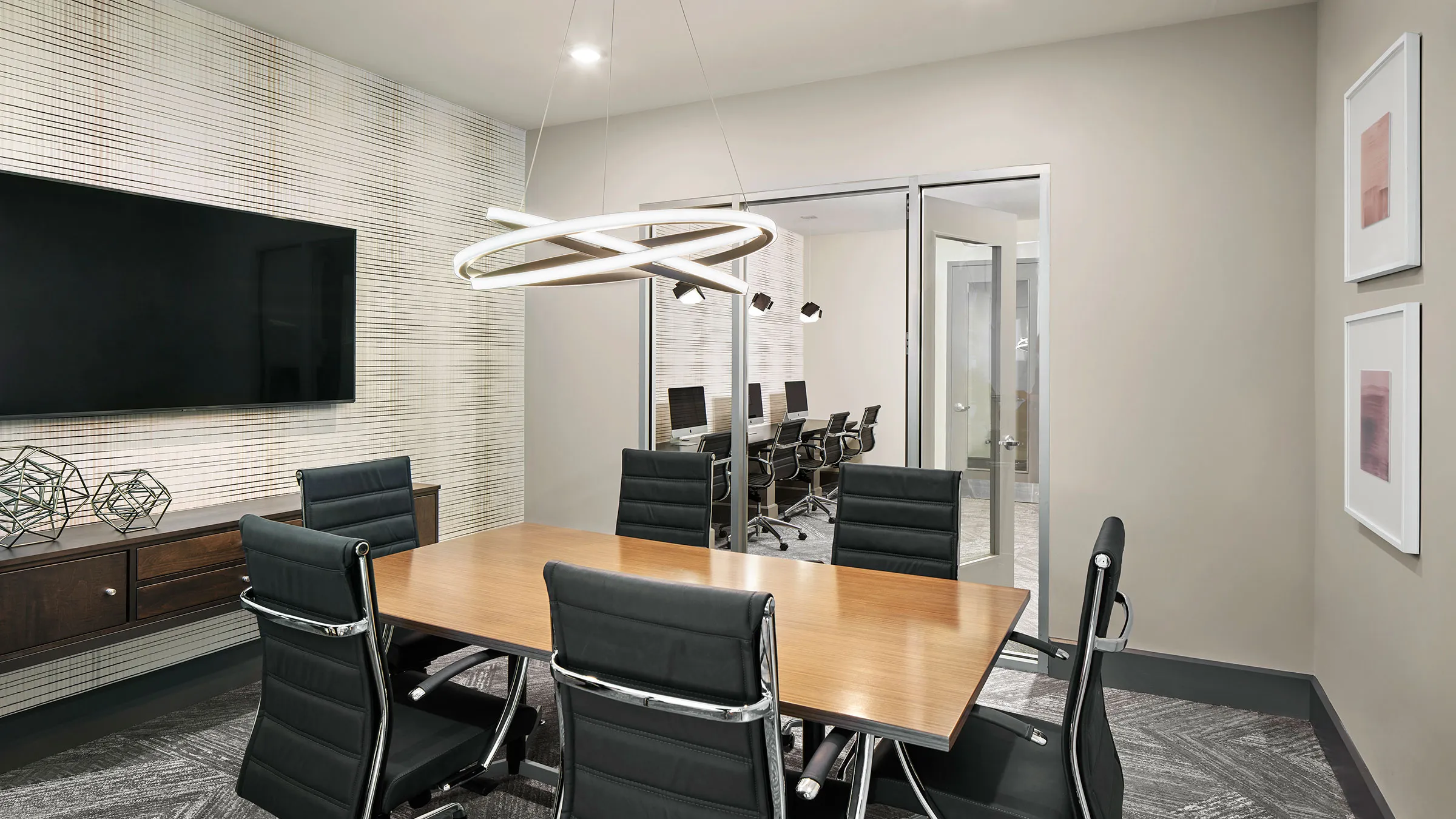 a conference room with a table and chairs